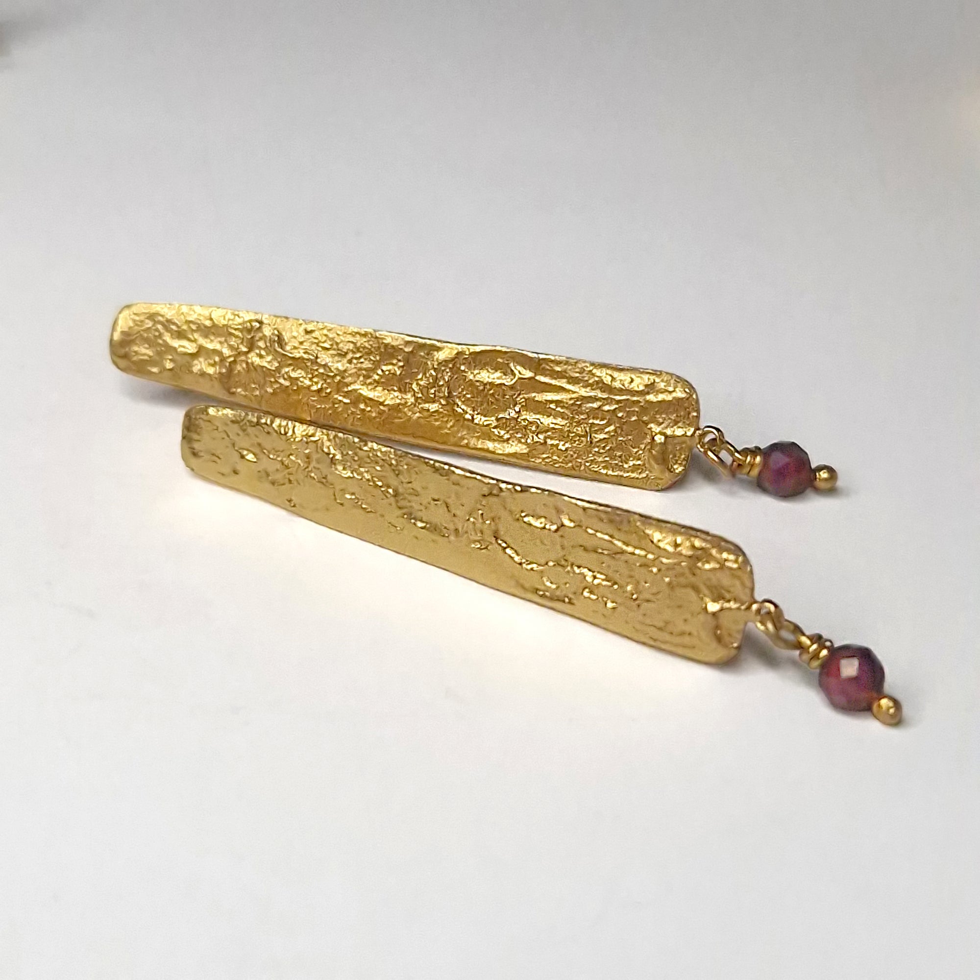 Gold plated sterling silver long stud earrings with Garnet