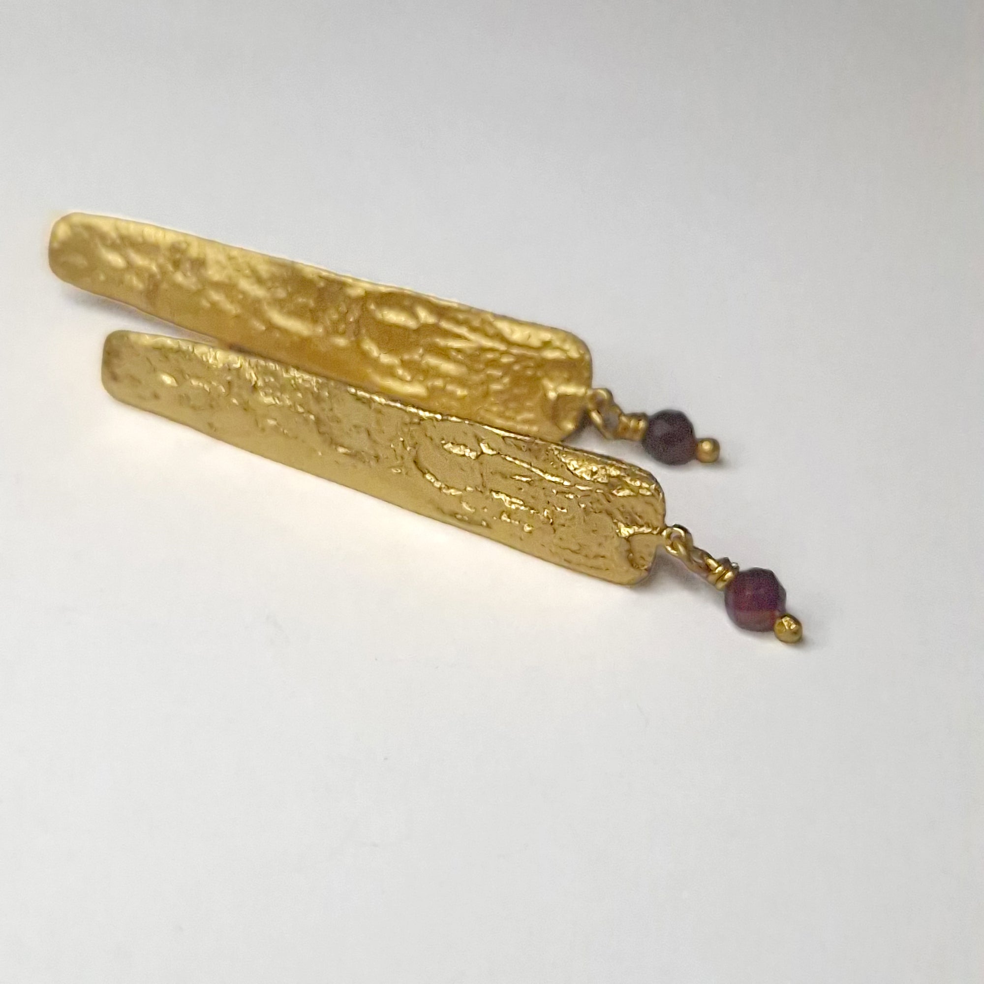 Gold plated sterling silver long stud earrings with Garnet