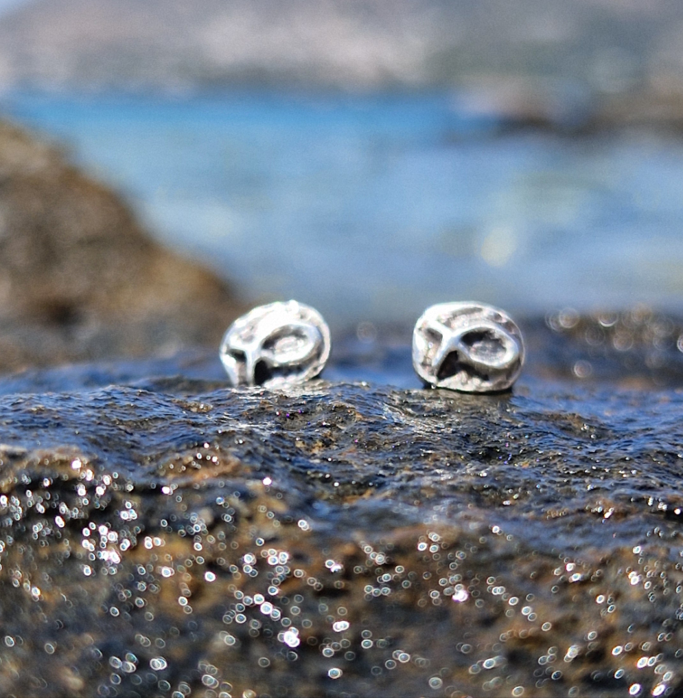 Small sterling silver fish earrings, hand carved design.