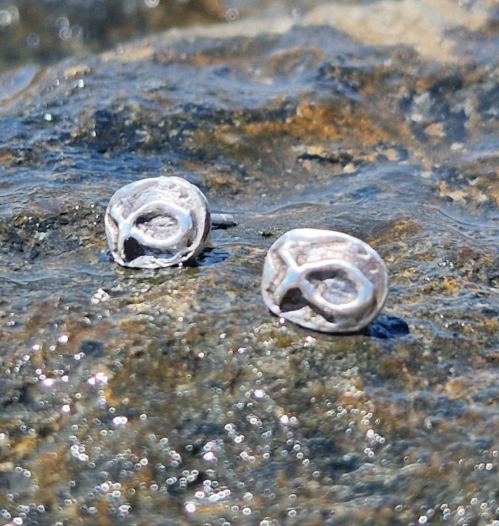 Small sterling silver fish earrings, hand carved design.