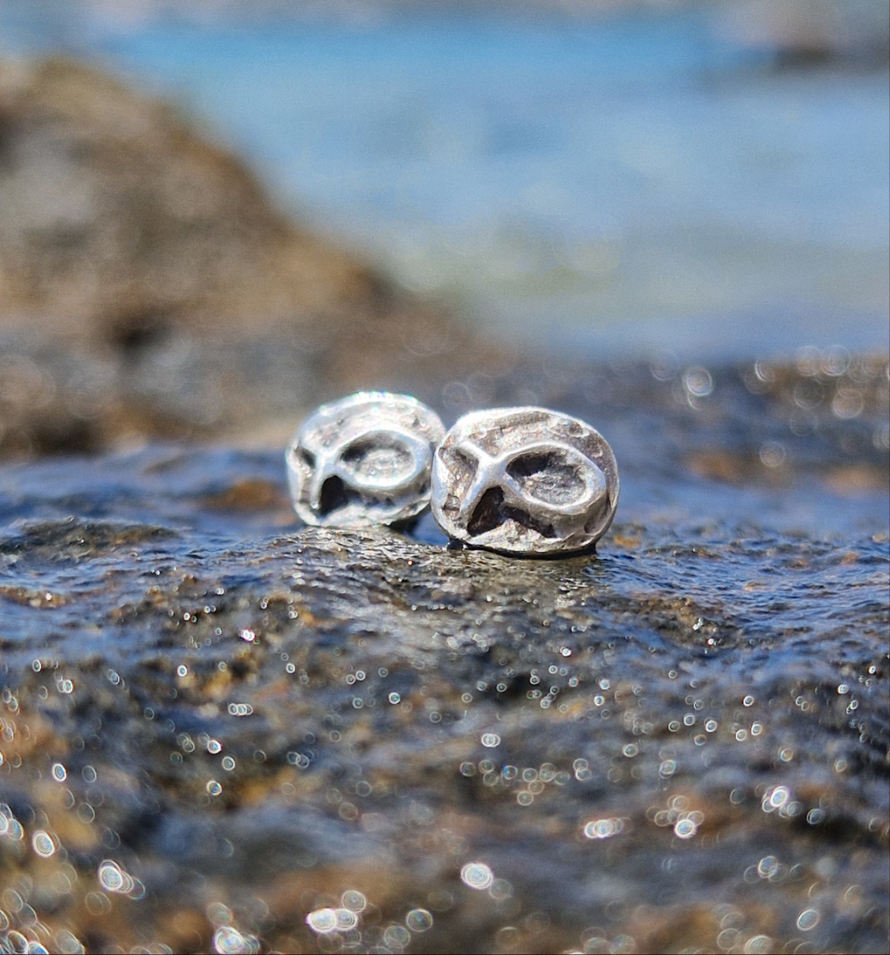 Small sterling silver fish earrings, hand carved design.