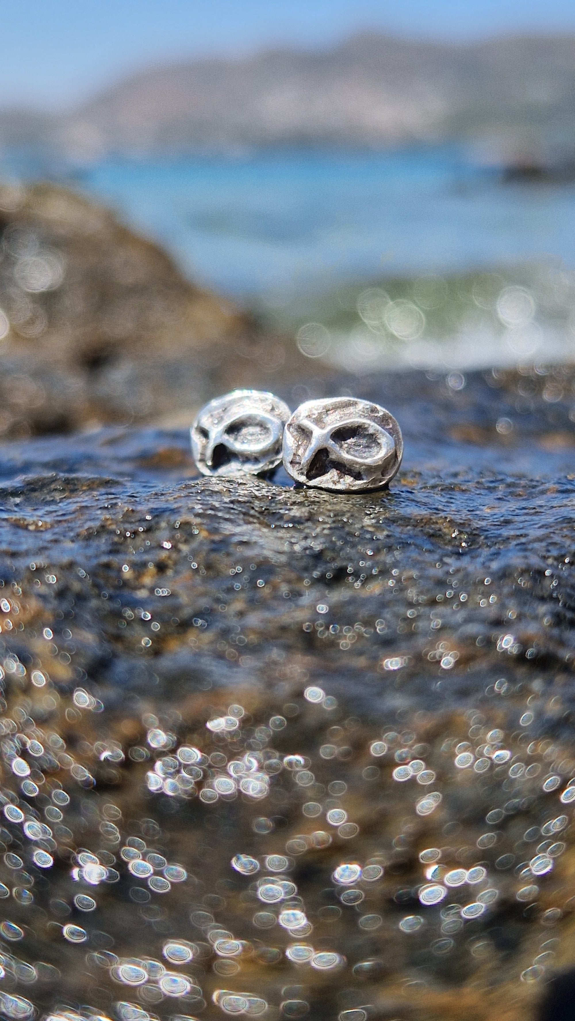 Small sterling silver fish earrings, hand carved design.