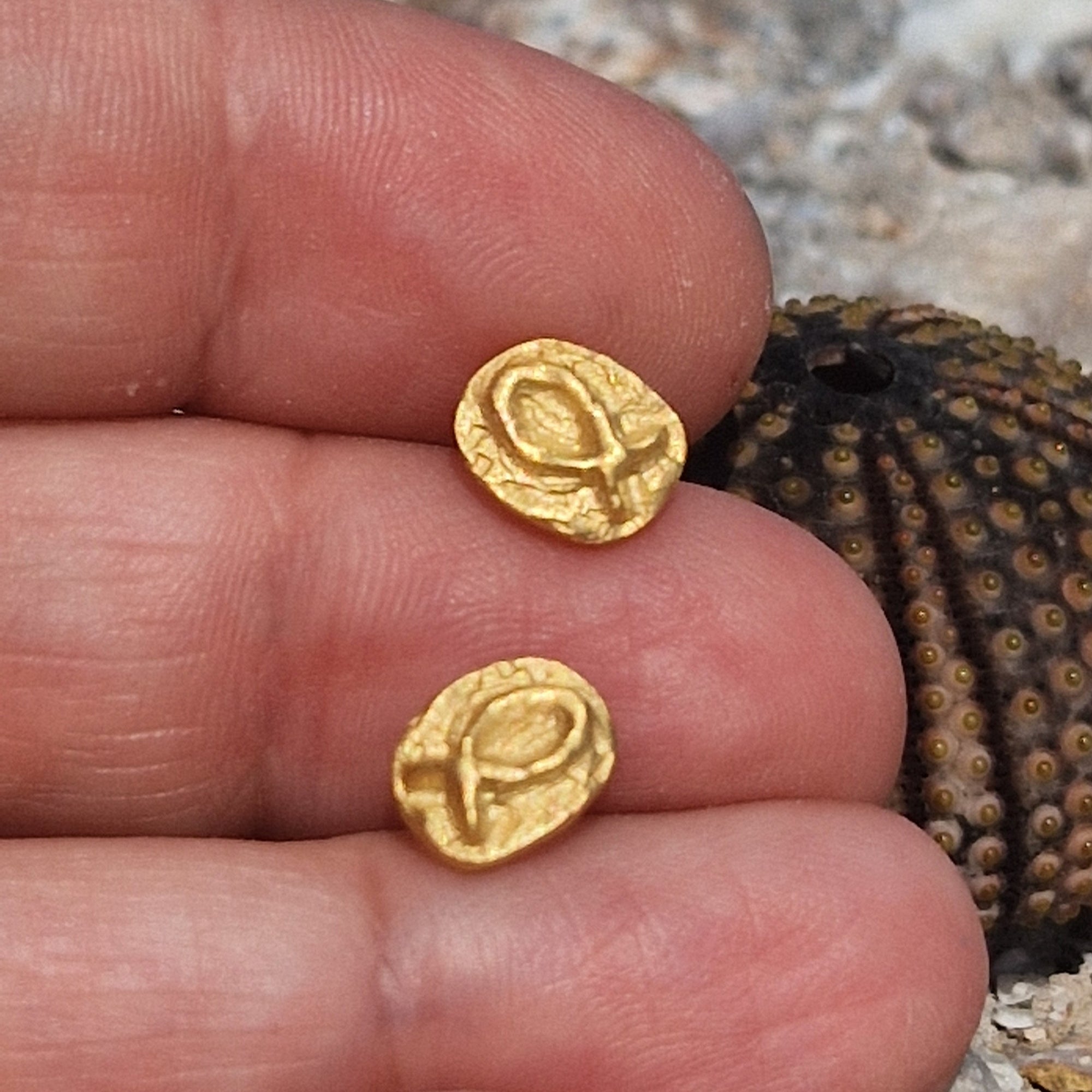 Small gold-plated sterling silver fish earrings, hand carved design.