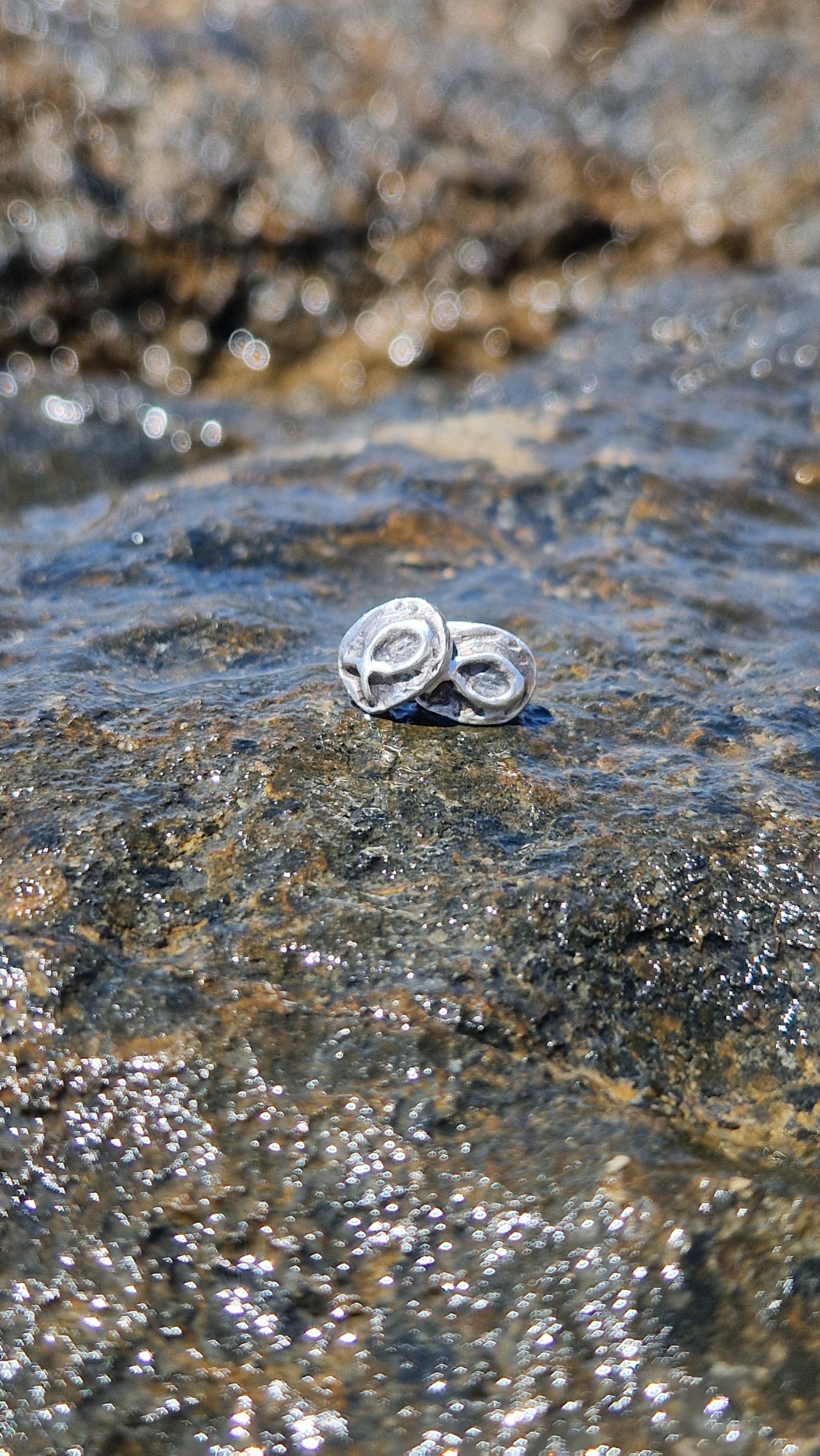 Small sterling silver fish earrings, hand carved design.