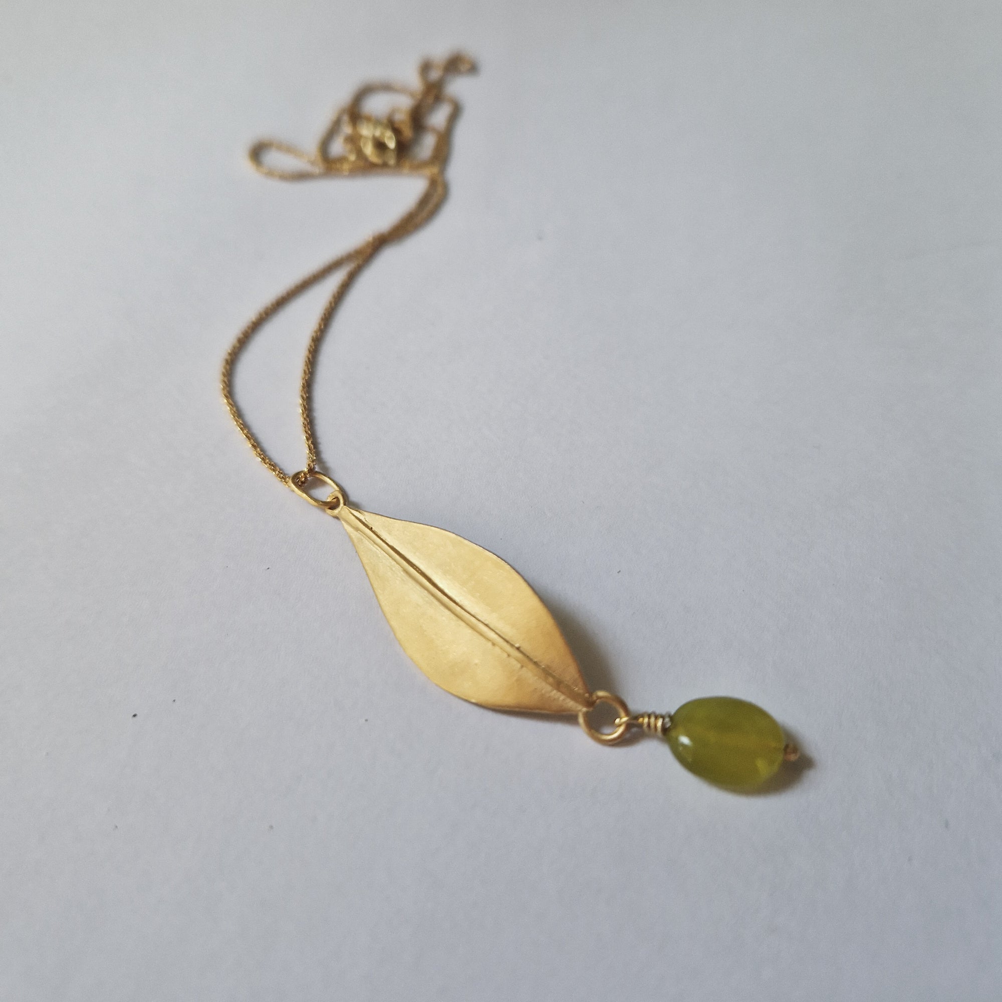 Gold olive leaf necklace with dangling green Jade