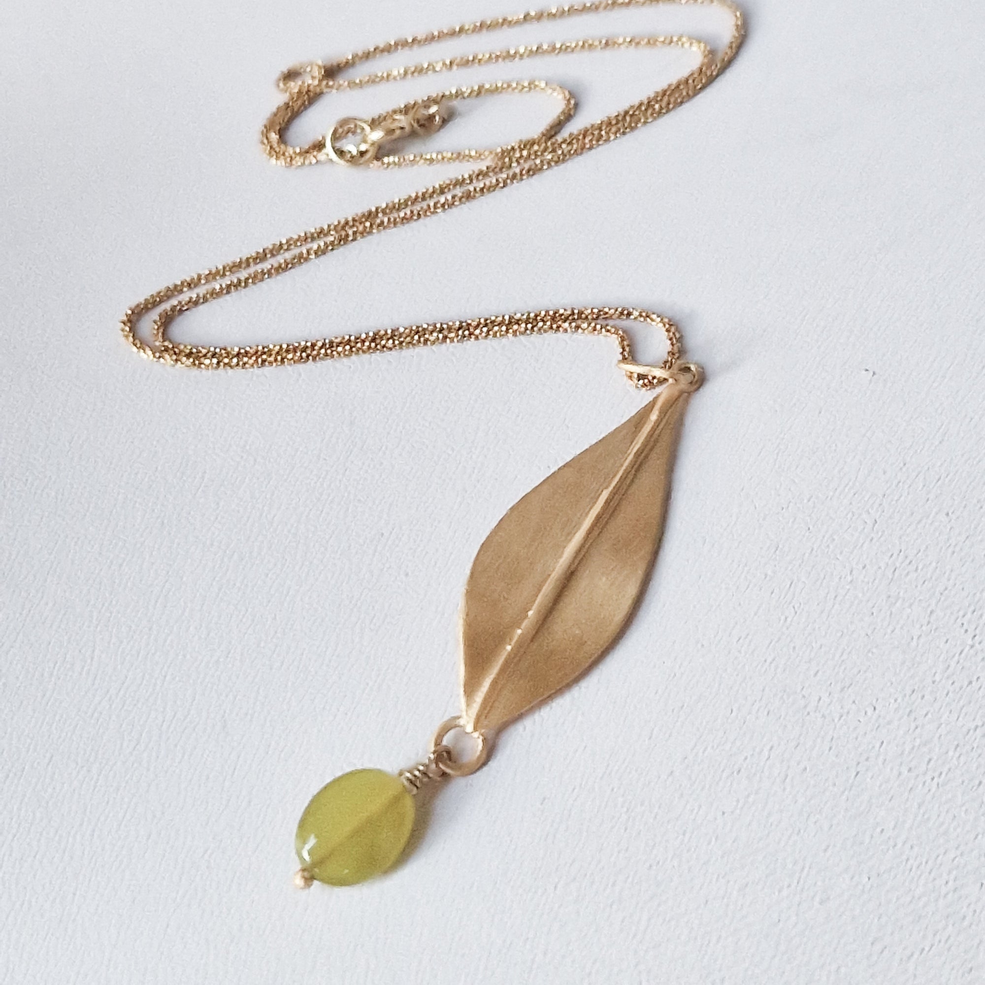 Gold olive leaf necklace with dangling green Jade