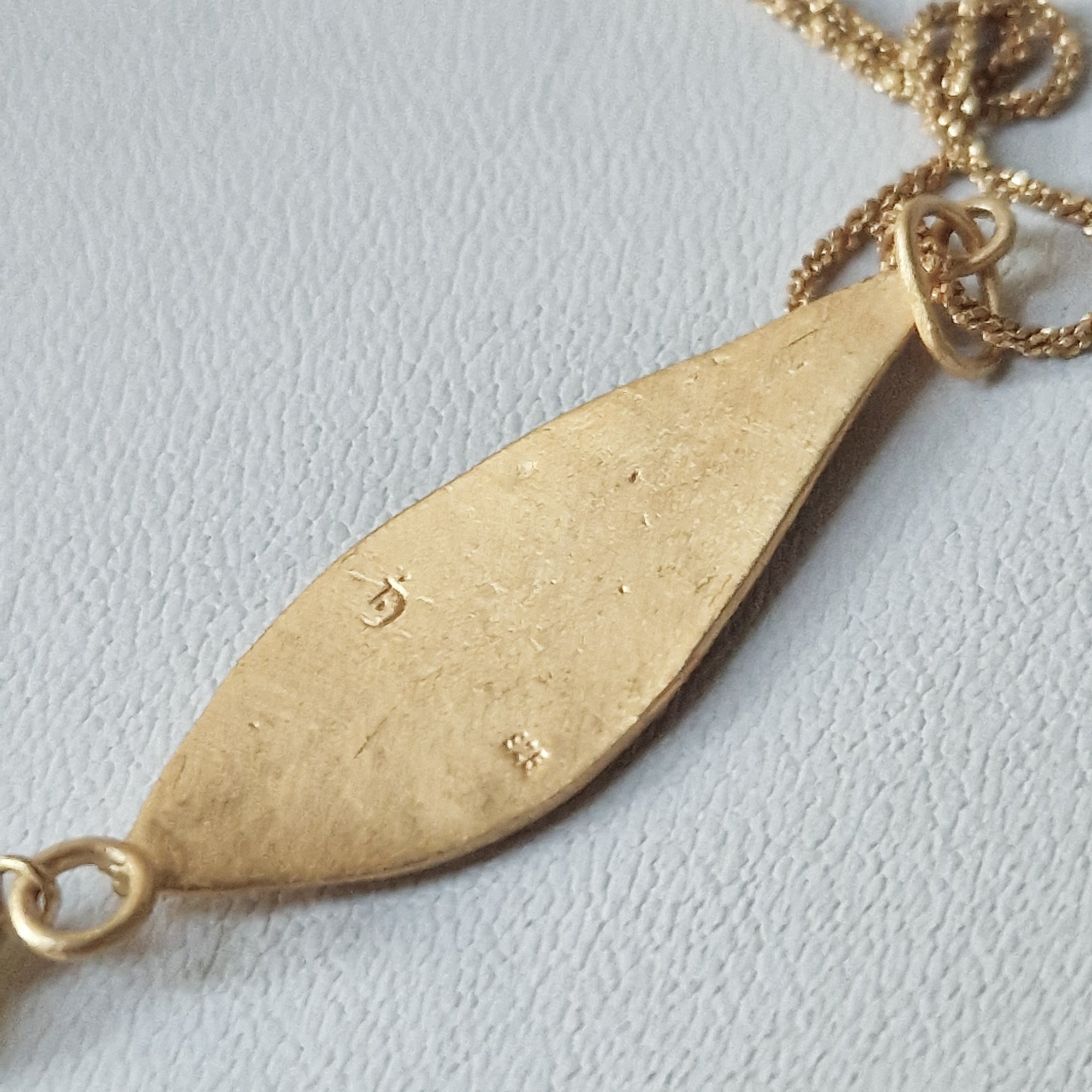 Gold olive leaf necklace with dangling green Jade