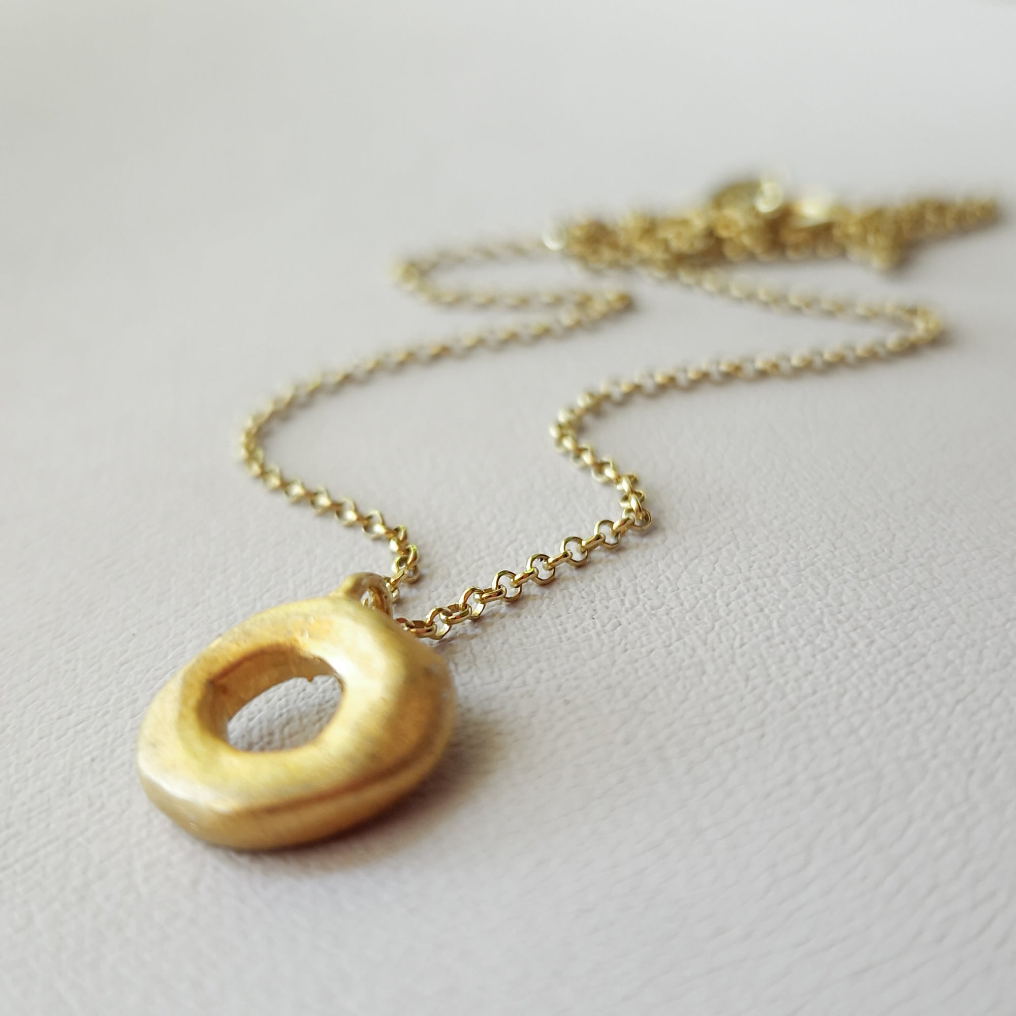 Small gold circle necklace