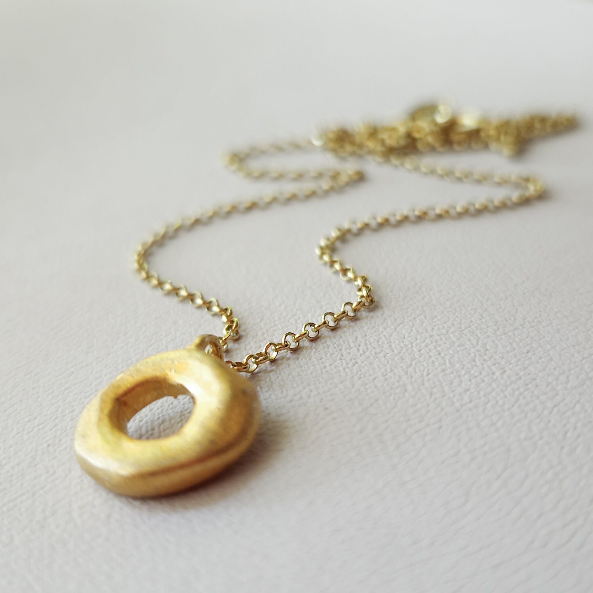 Small gold circle necklace