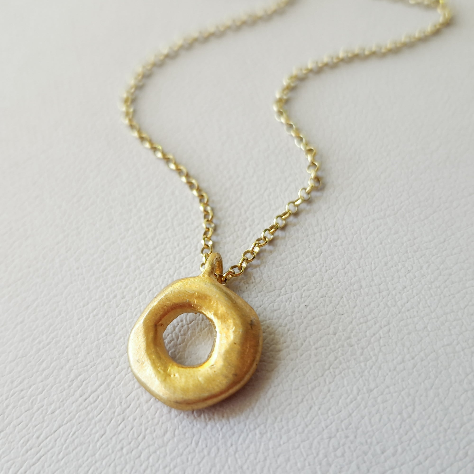 Small gold circle necklace