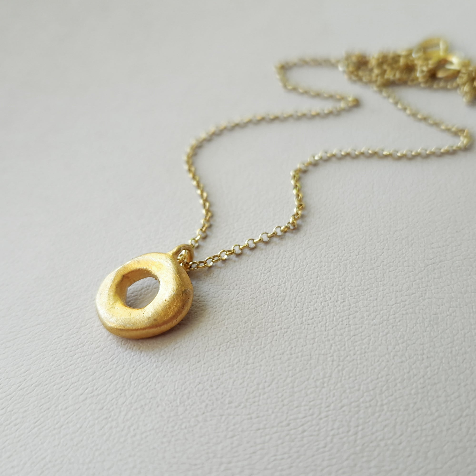 Small gold circle necklace