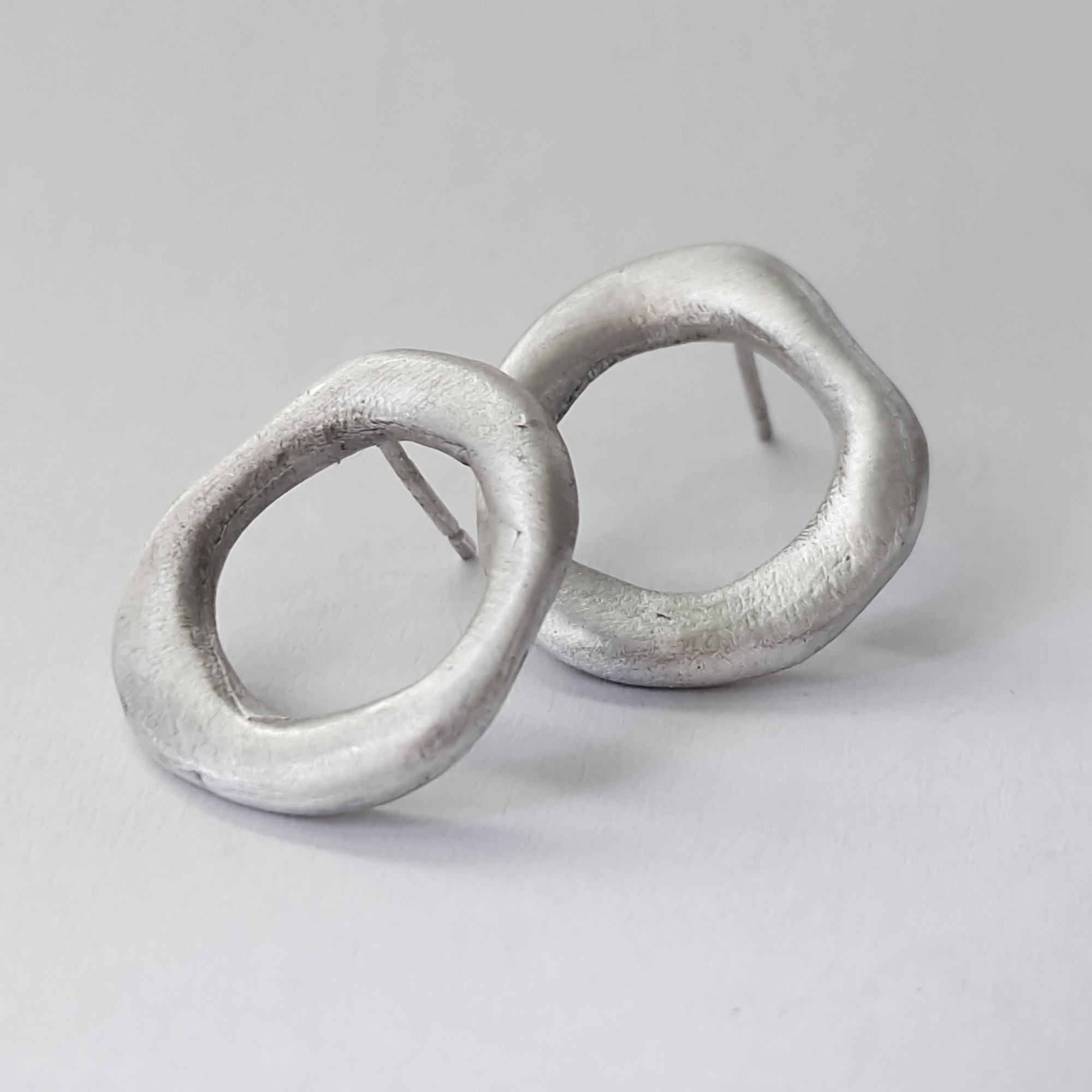 Medium - sized silver front facing hoops