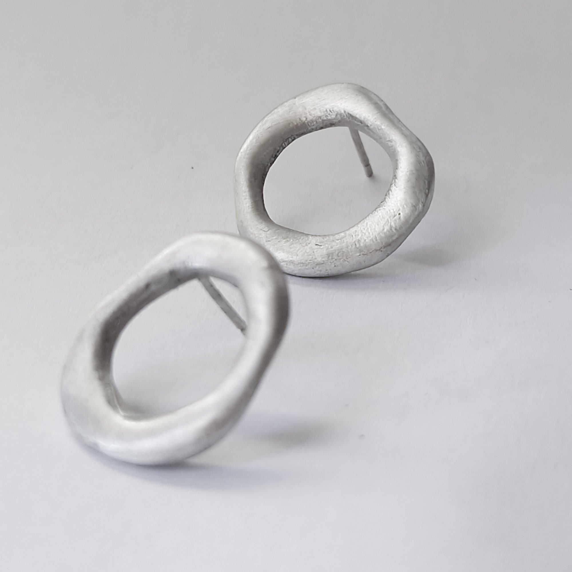 Medium - sized silver front facing hoops