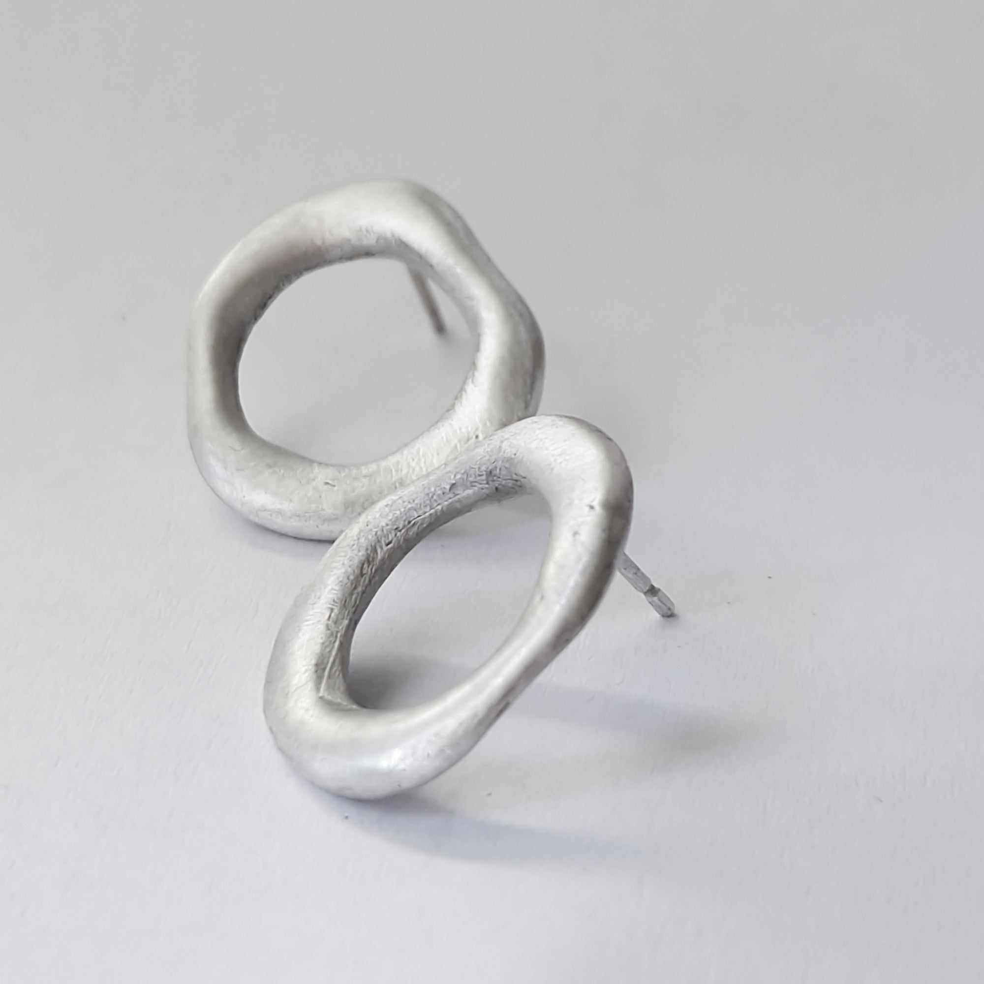 Medium - sized silver front facing hoops