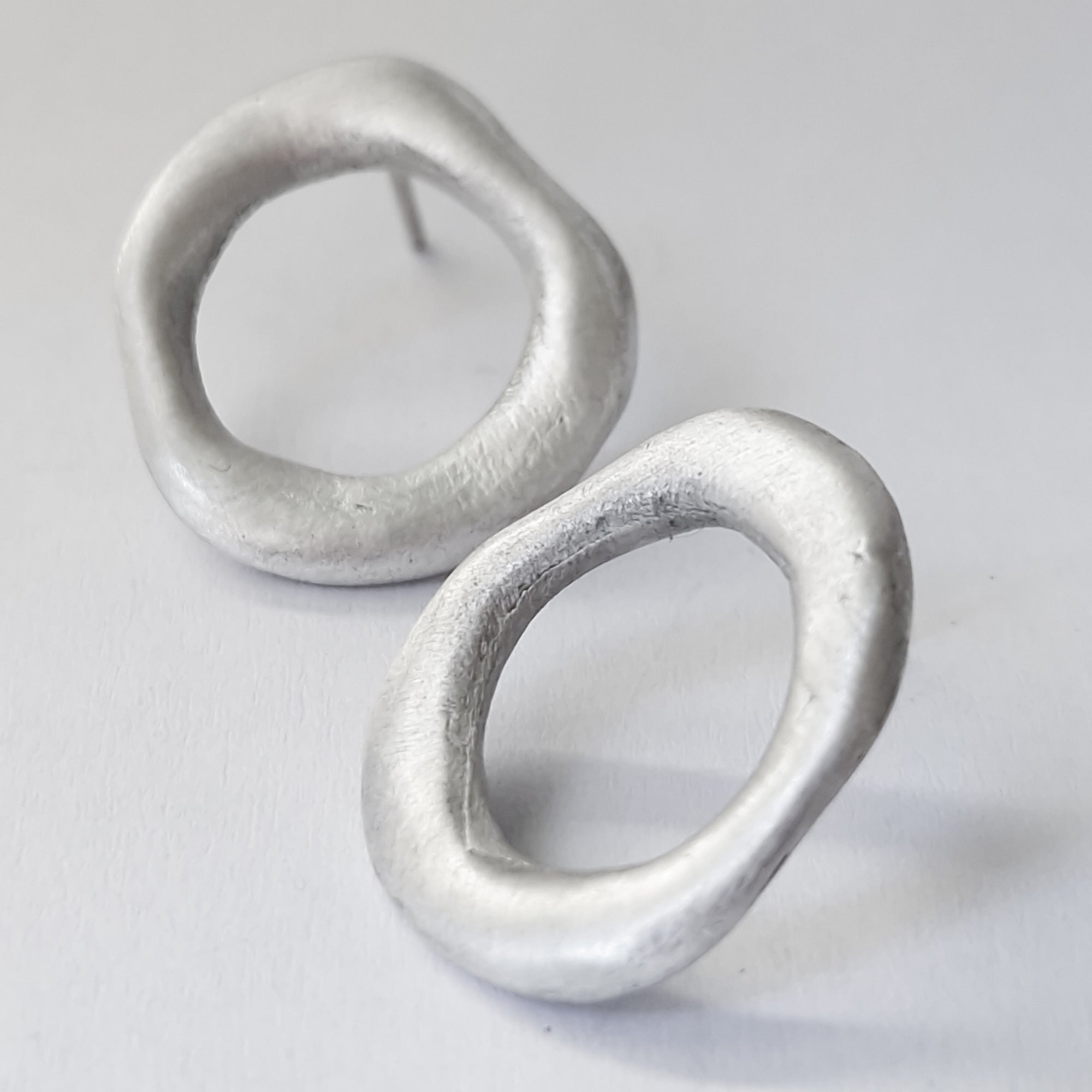 Medium - sized silver front facing hoops