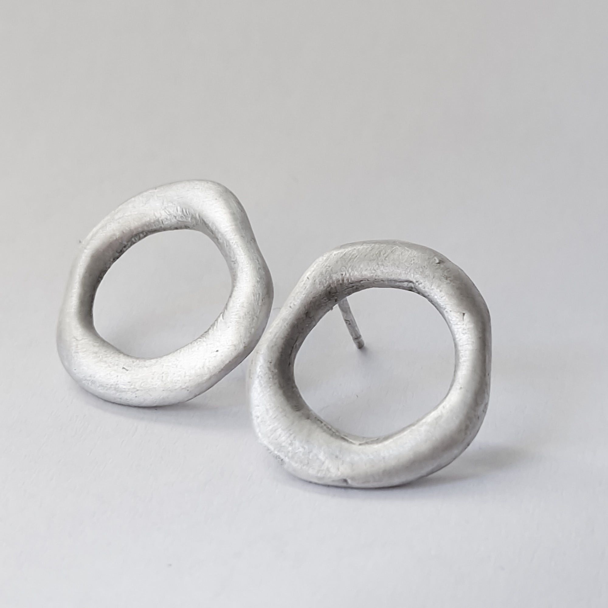 Medium - sized silver front facing hoops