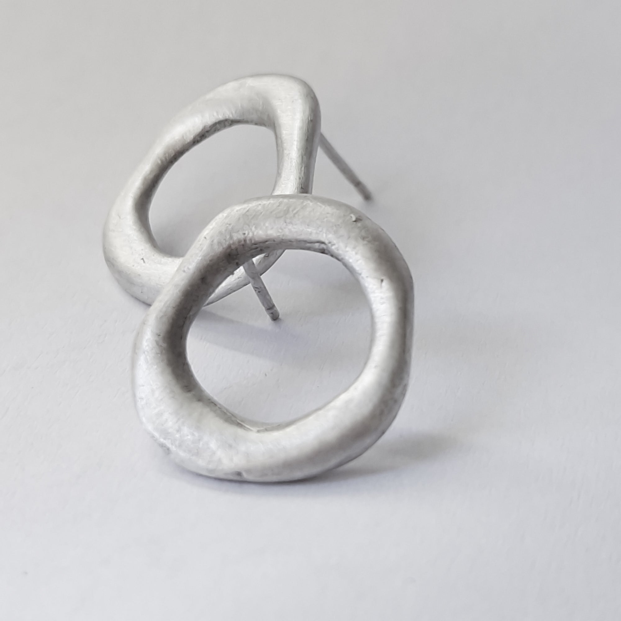 Medium - sized silver front facing hoops