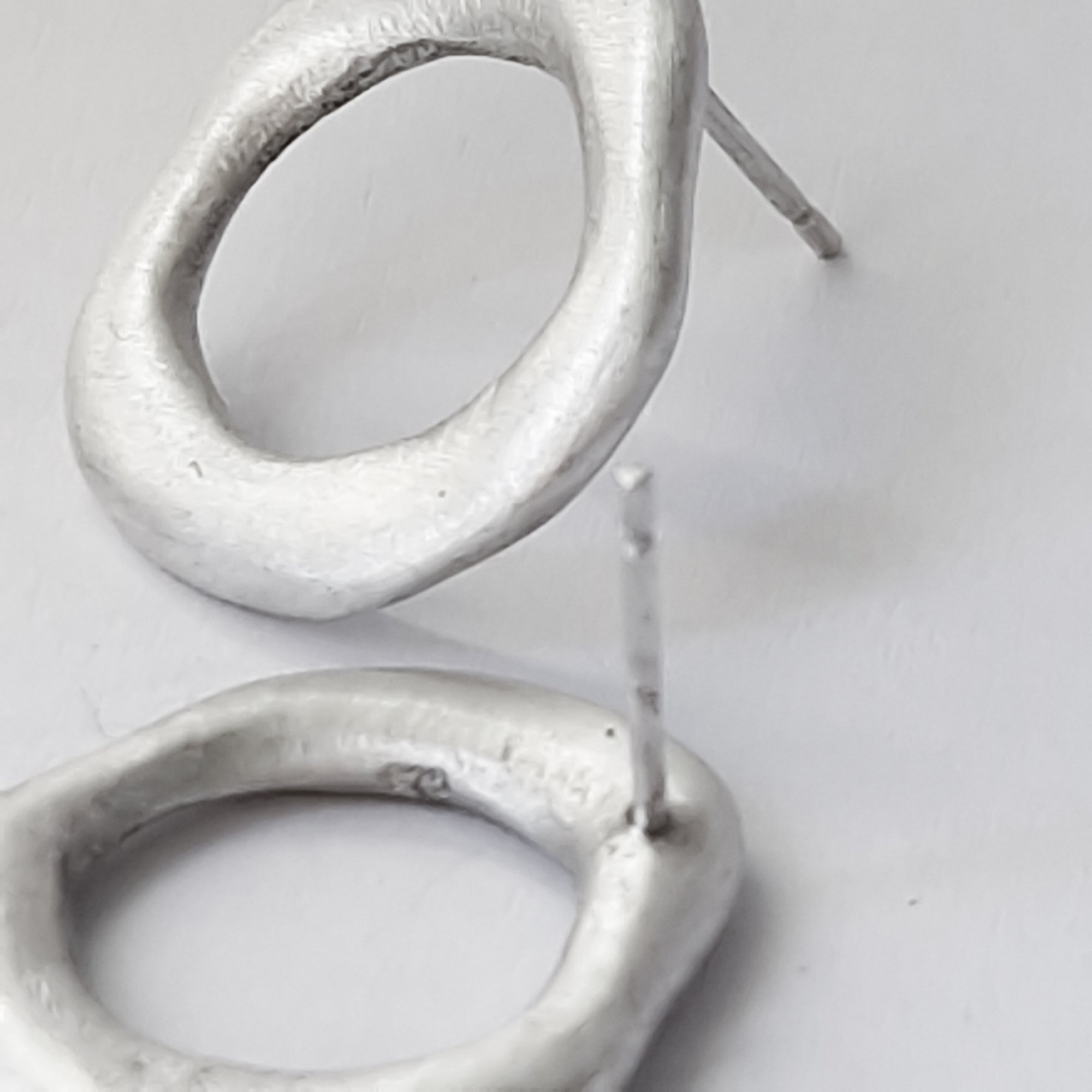 Medium - sized silver front facing hoops