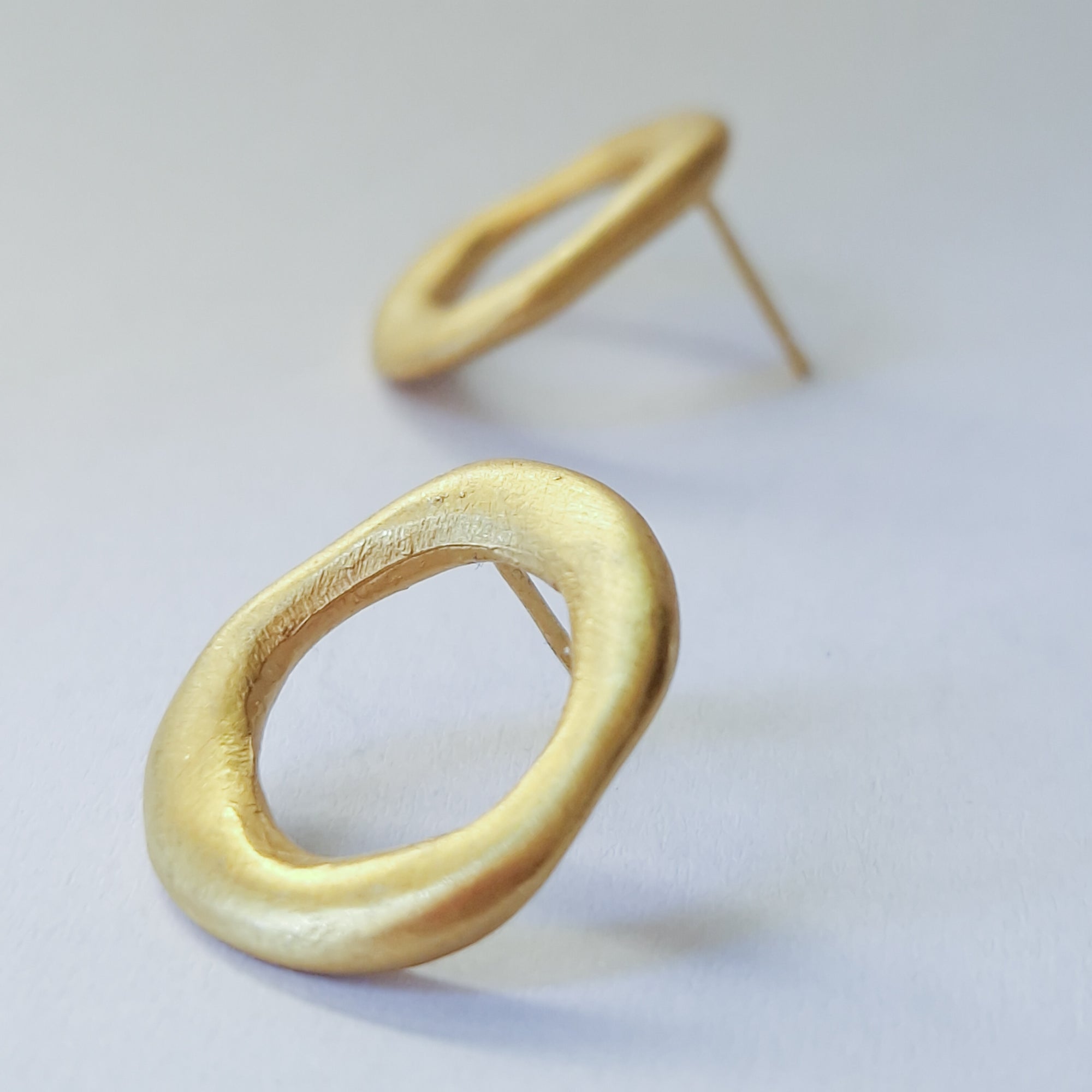 Medium - sized Gold plated front facing hoops.