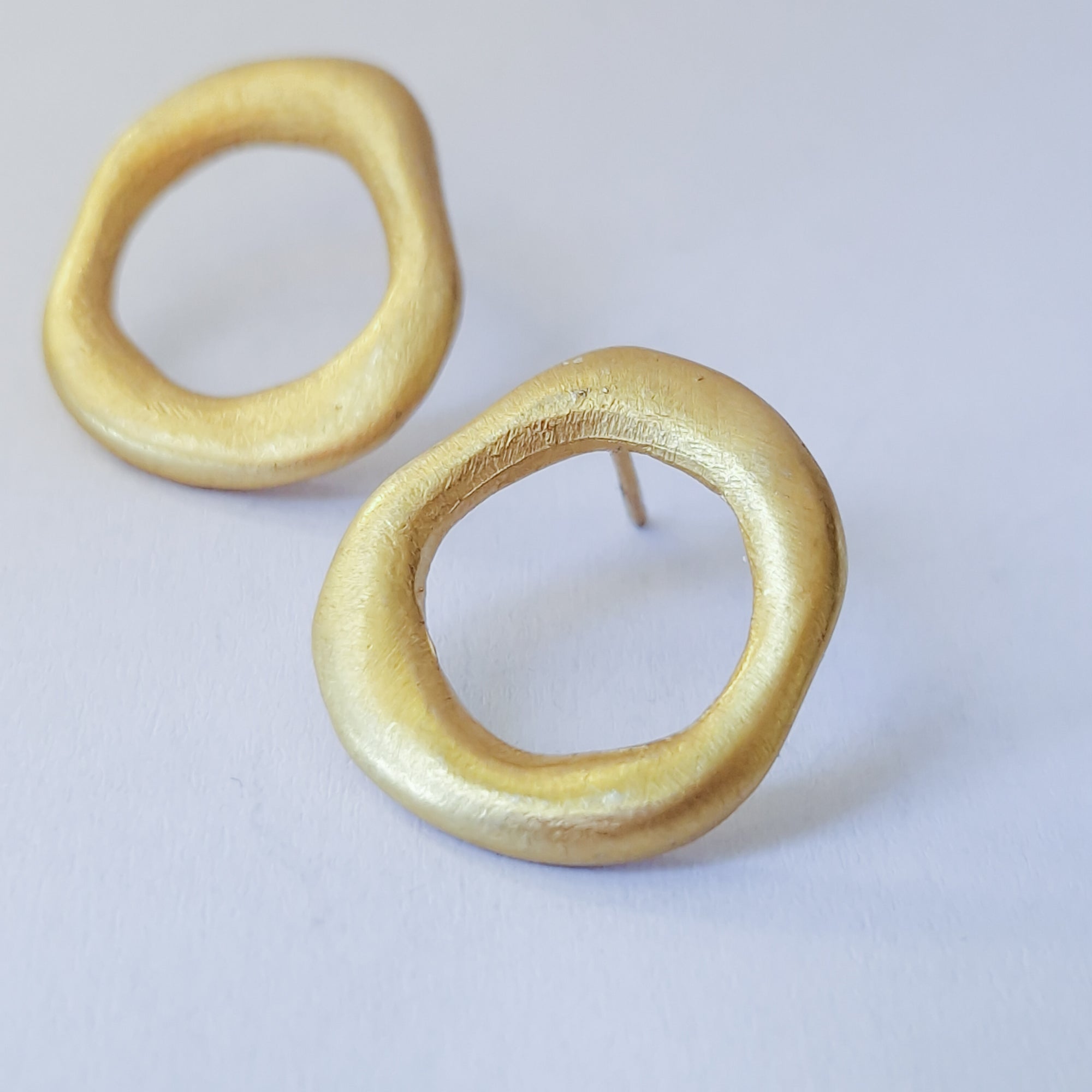 Medium - sized Gold plated front facing hoops.