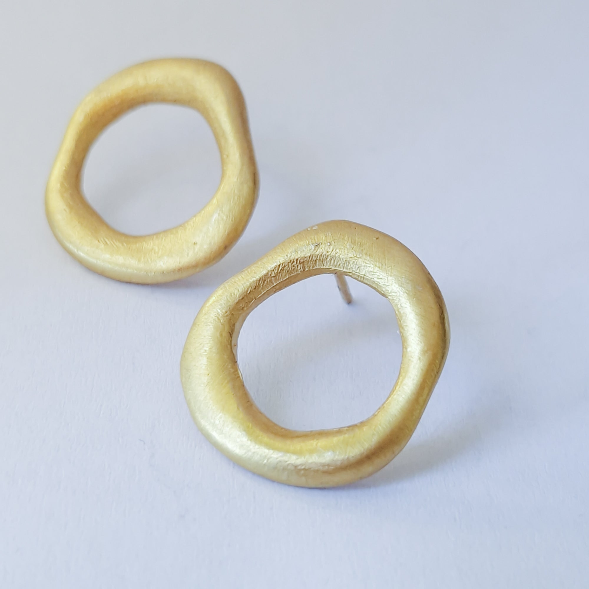 Medium - sized Gold plated front facing hoops.