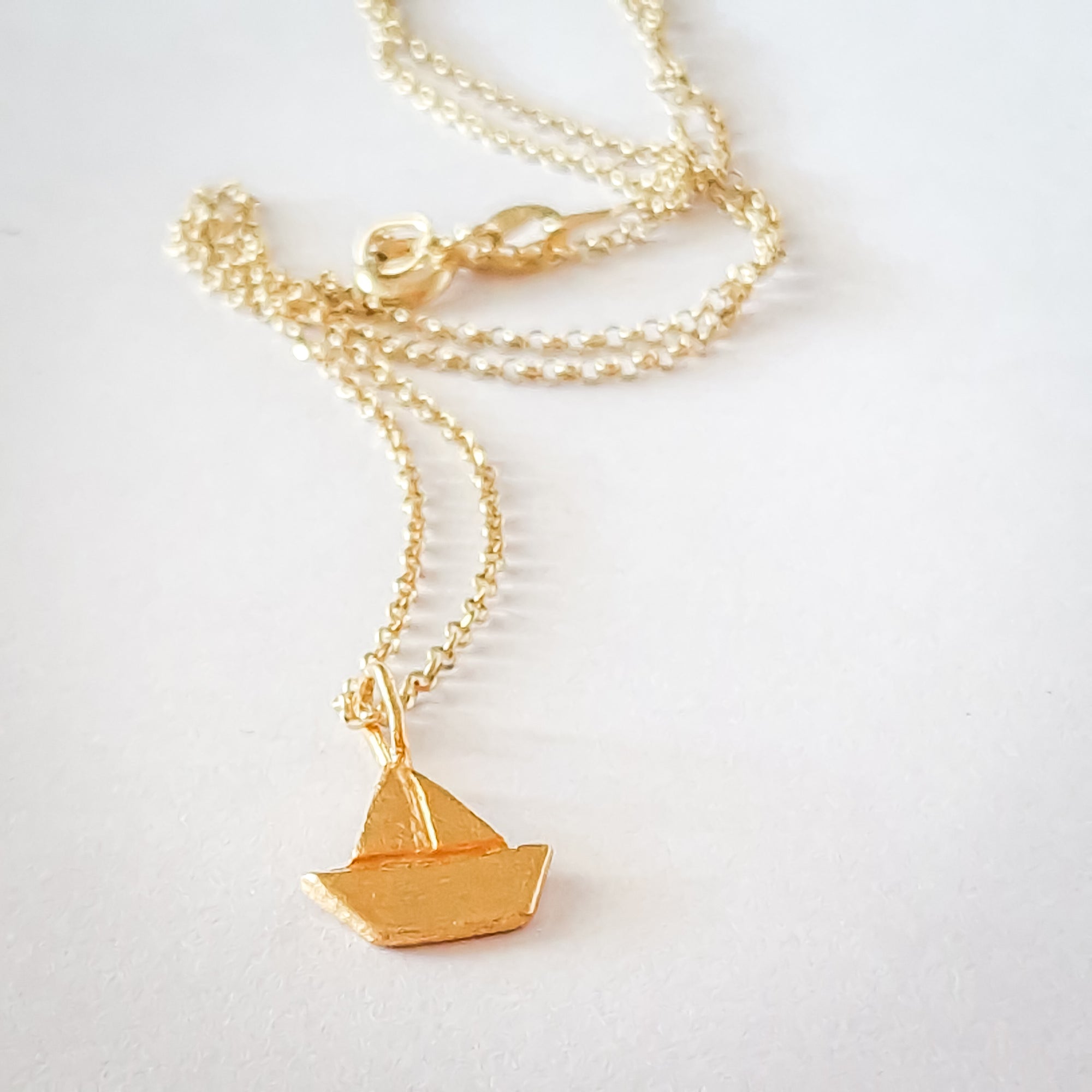 Gold boat necklace