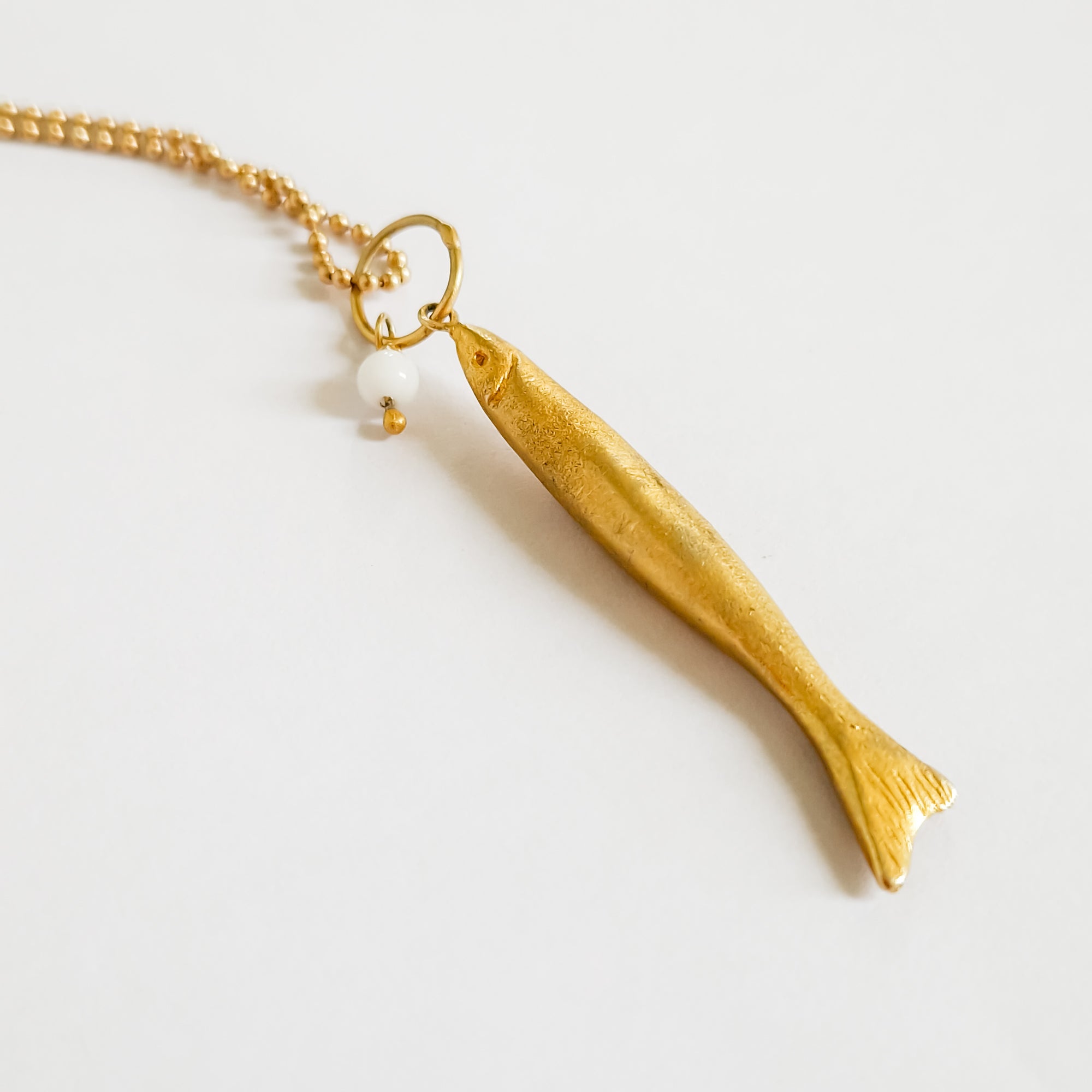 Long gold fish pendant