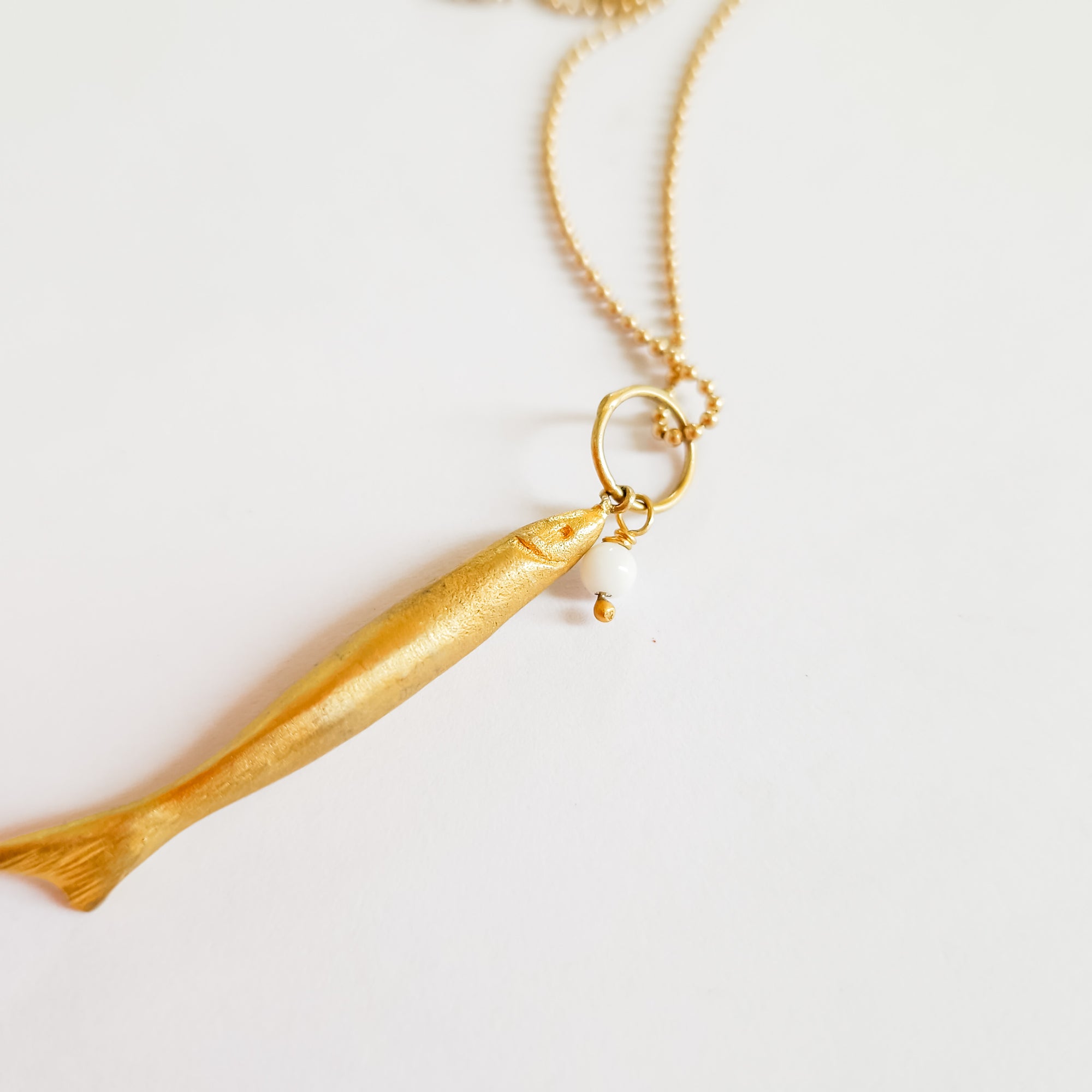 Long gold fish pendant