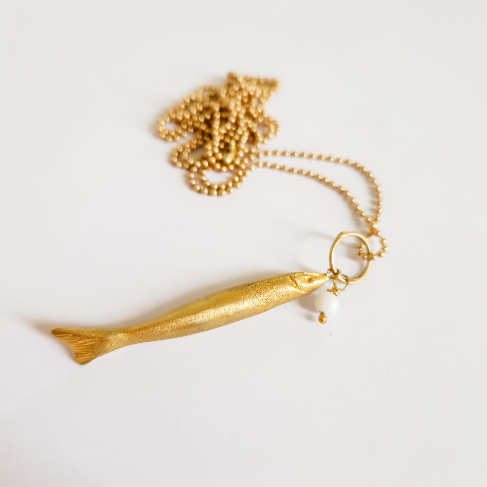 Long gold fish pendant