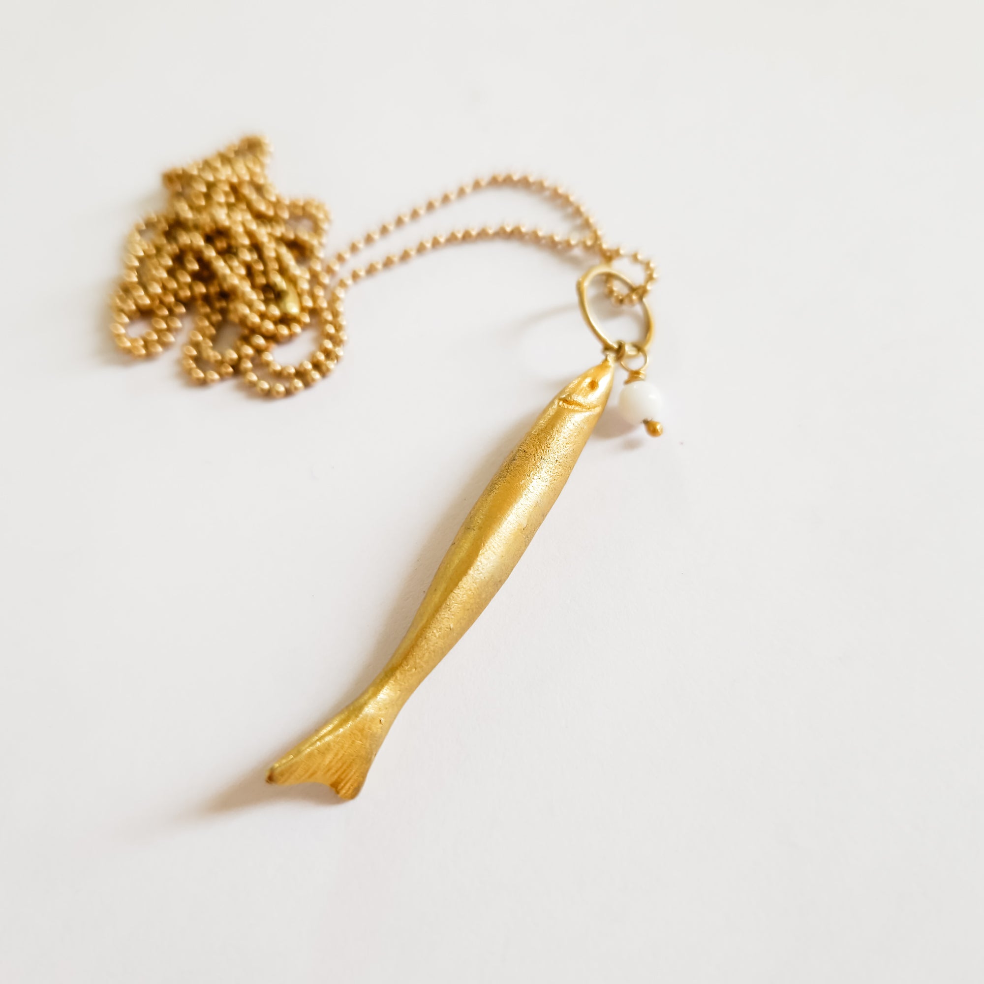 Long gold fish pendant