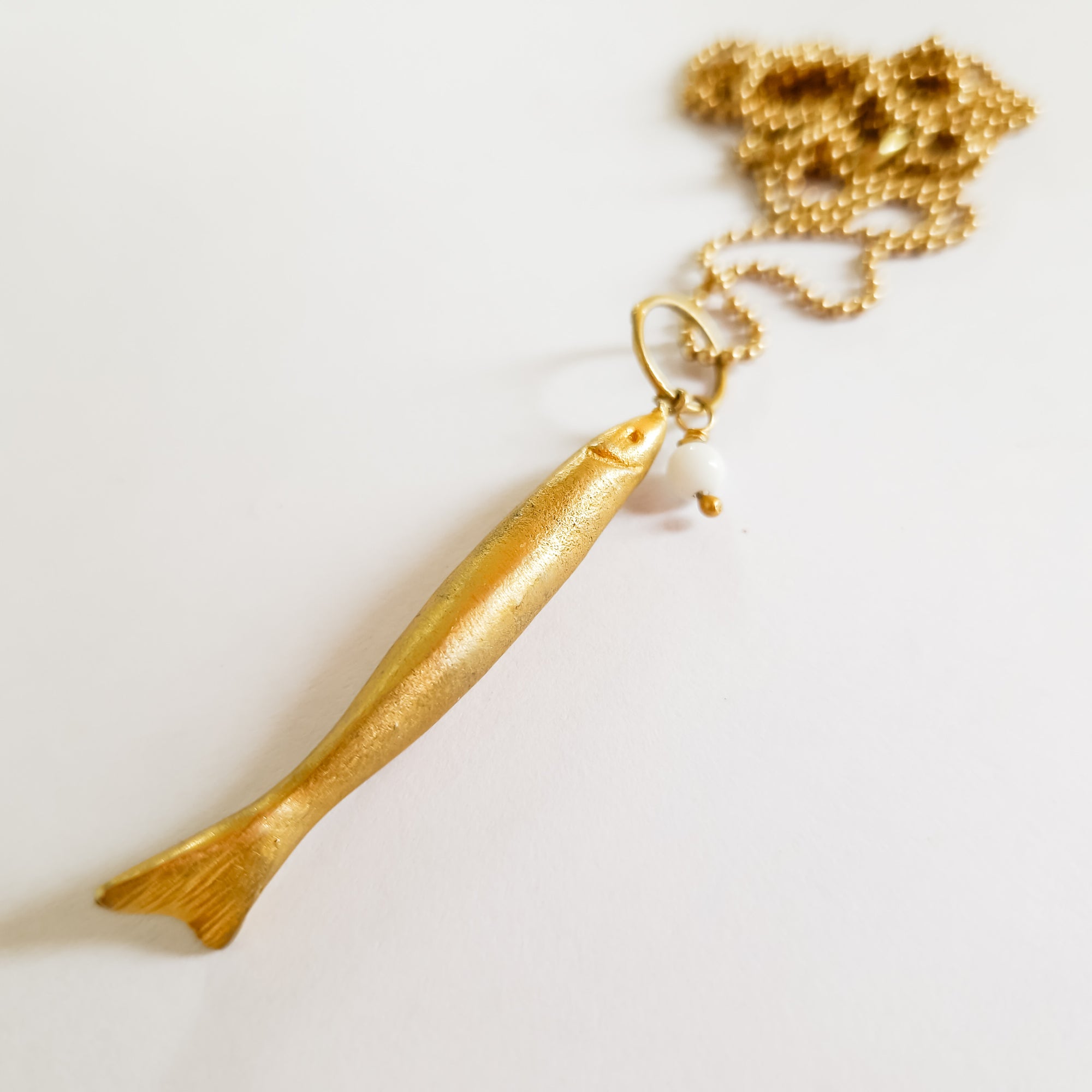 Long gold fish pendant