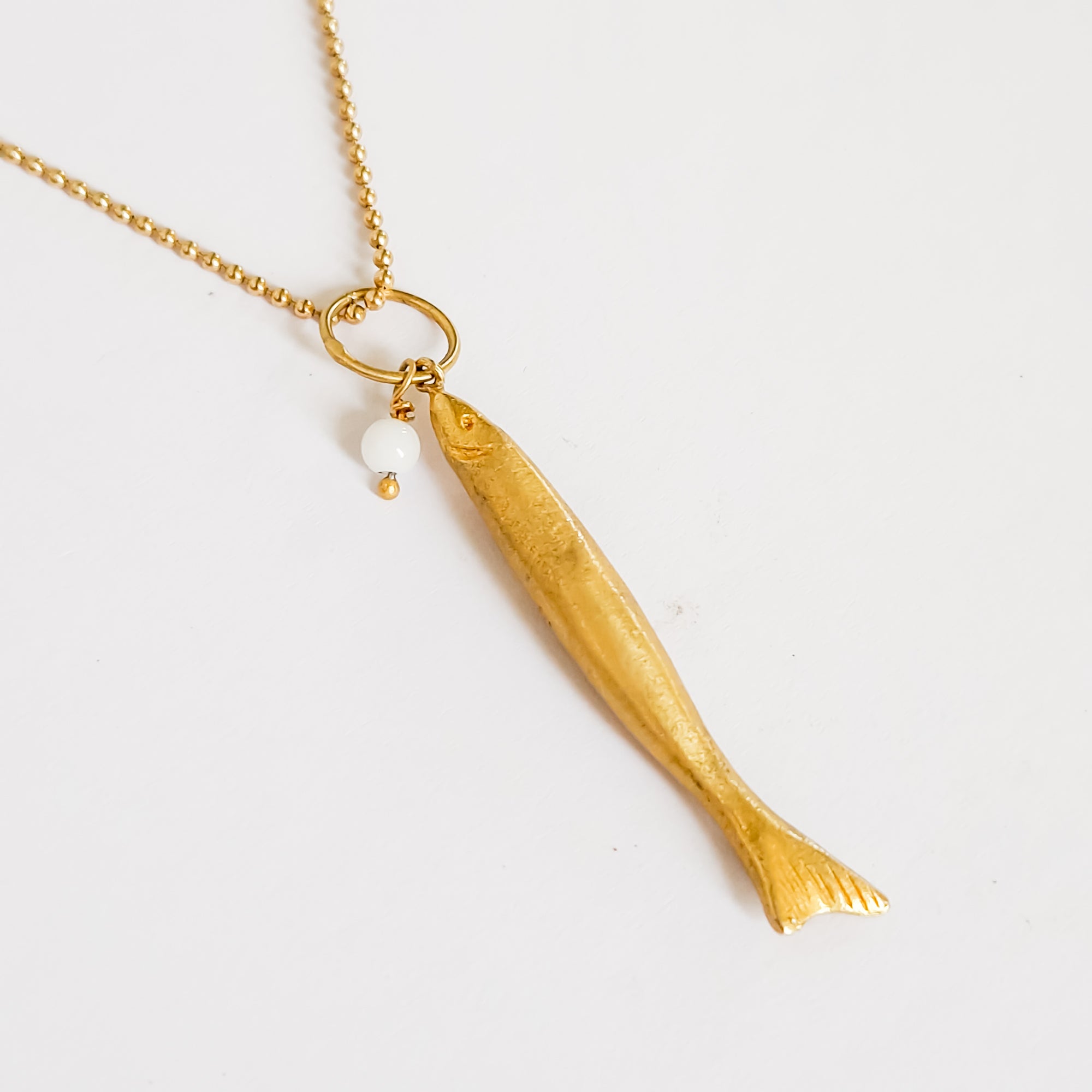 Long gold fish pendant