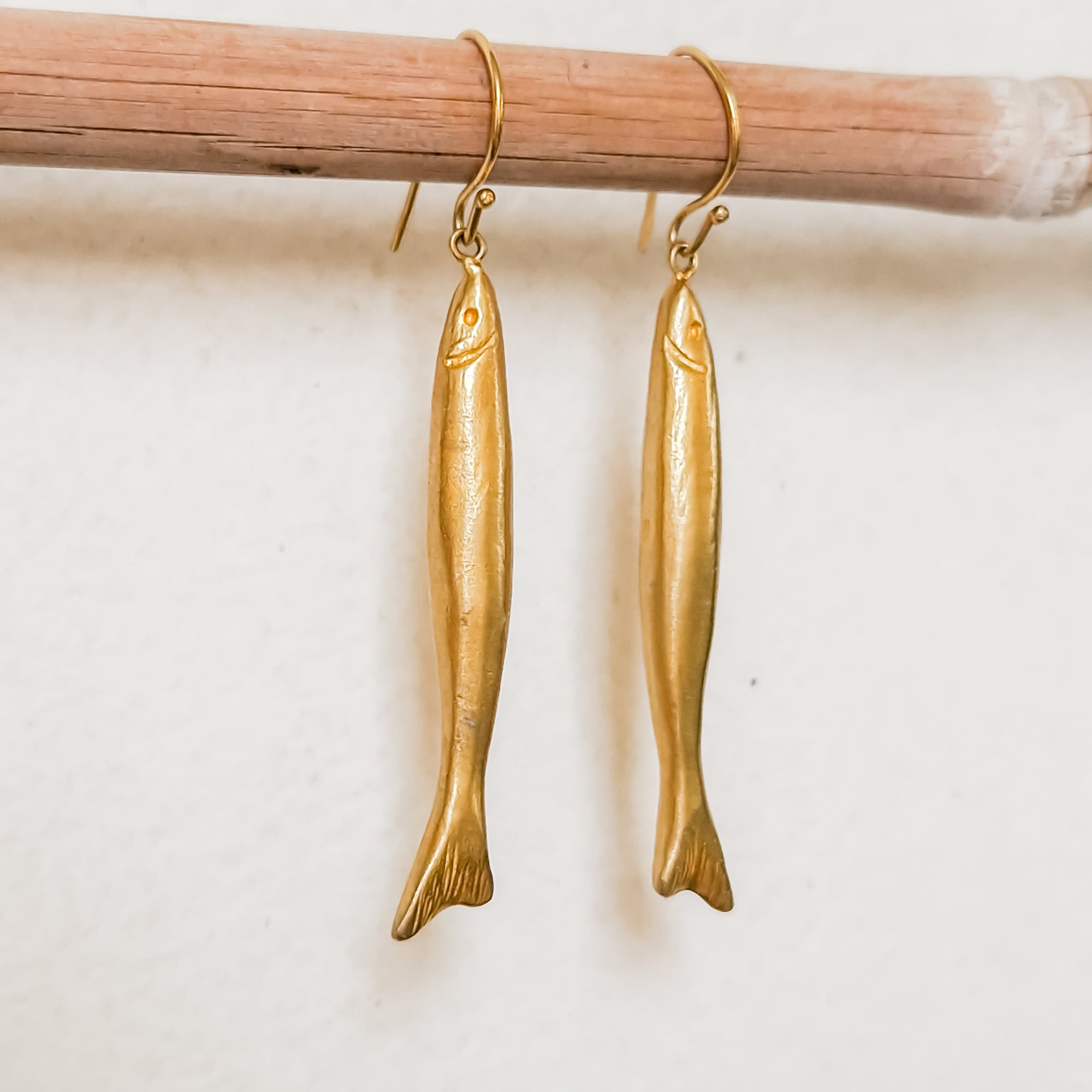 Long gold dangle earrings «fish»