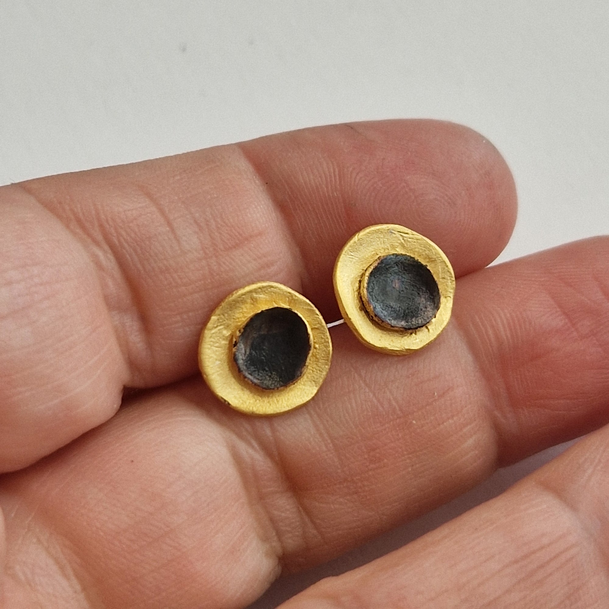 Small gold-plated silver earrings «Eclipse»  with matte finish and dark patina