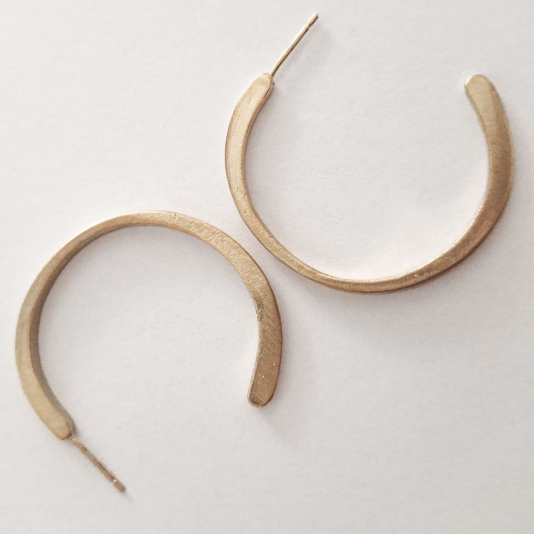 Large minimal hoop earrings in silver gold plated.