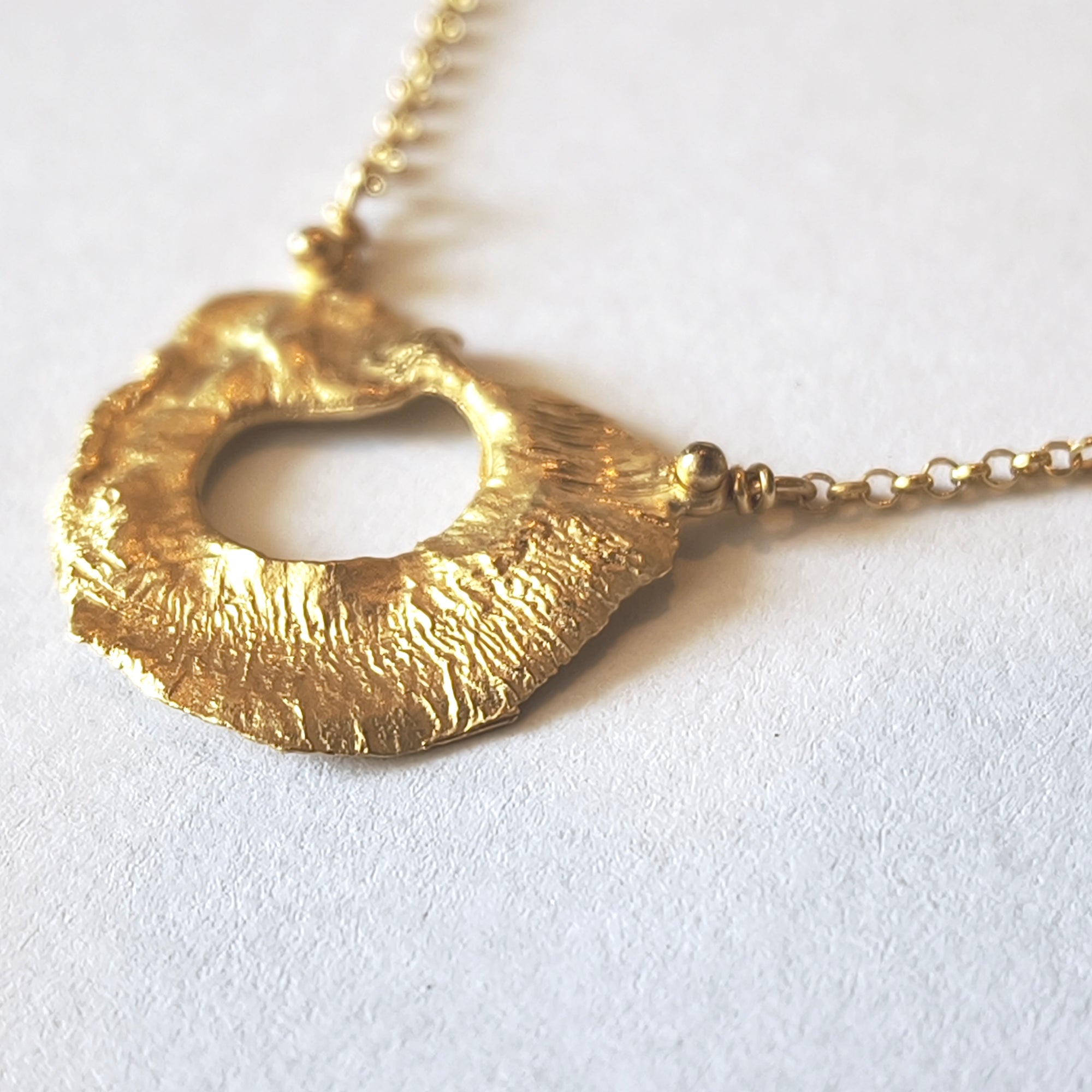 Organic sculptural texture of VOLCANO gold plated silver necklace