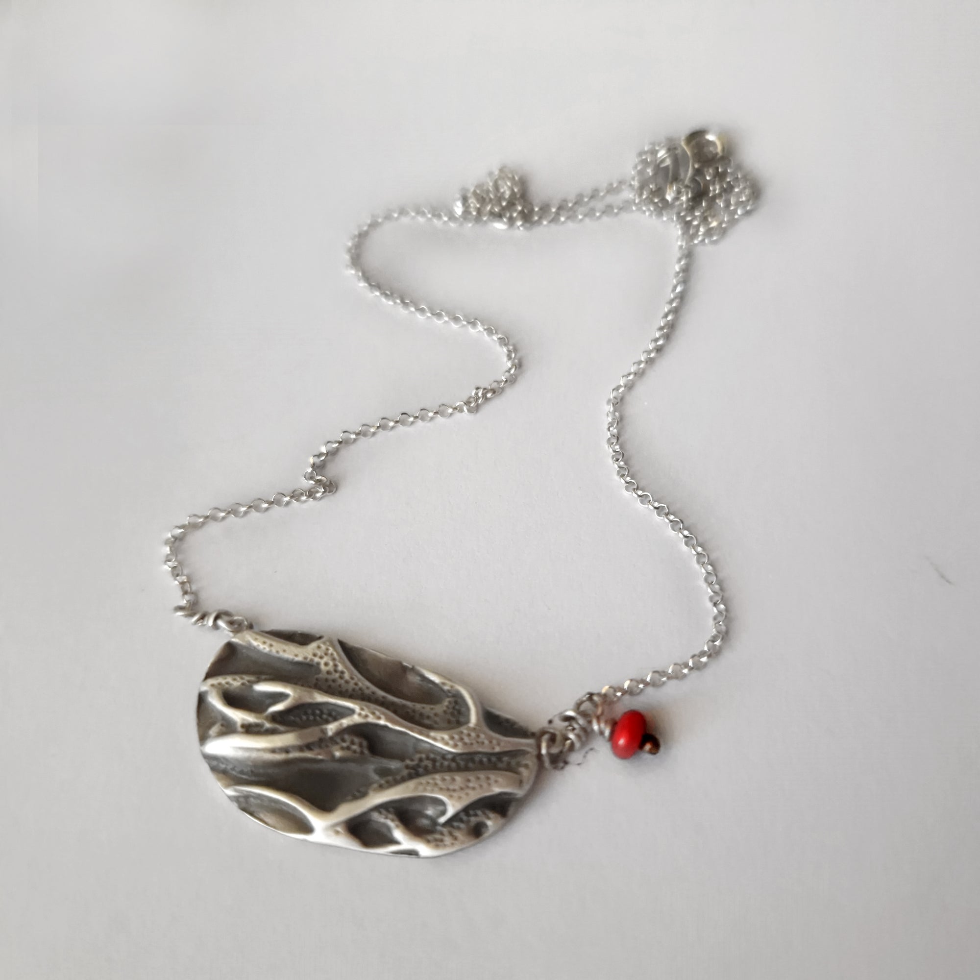 Silver necklace «coral» with dangling coral bead