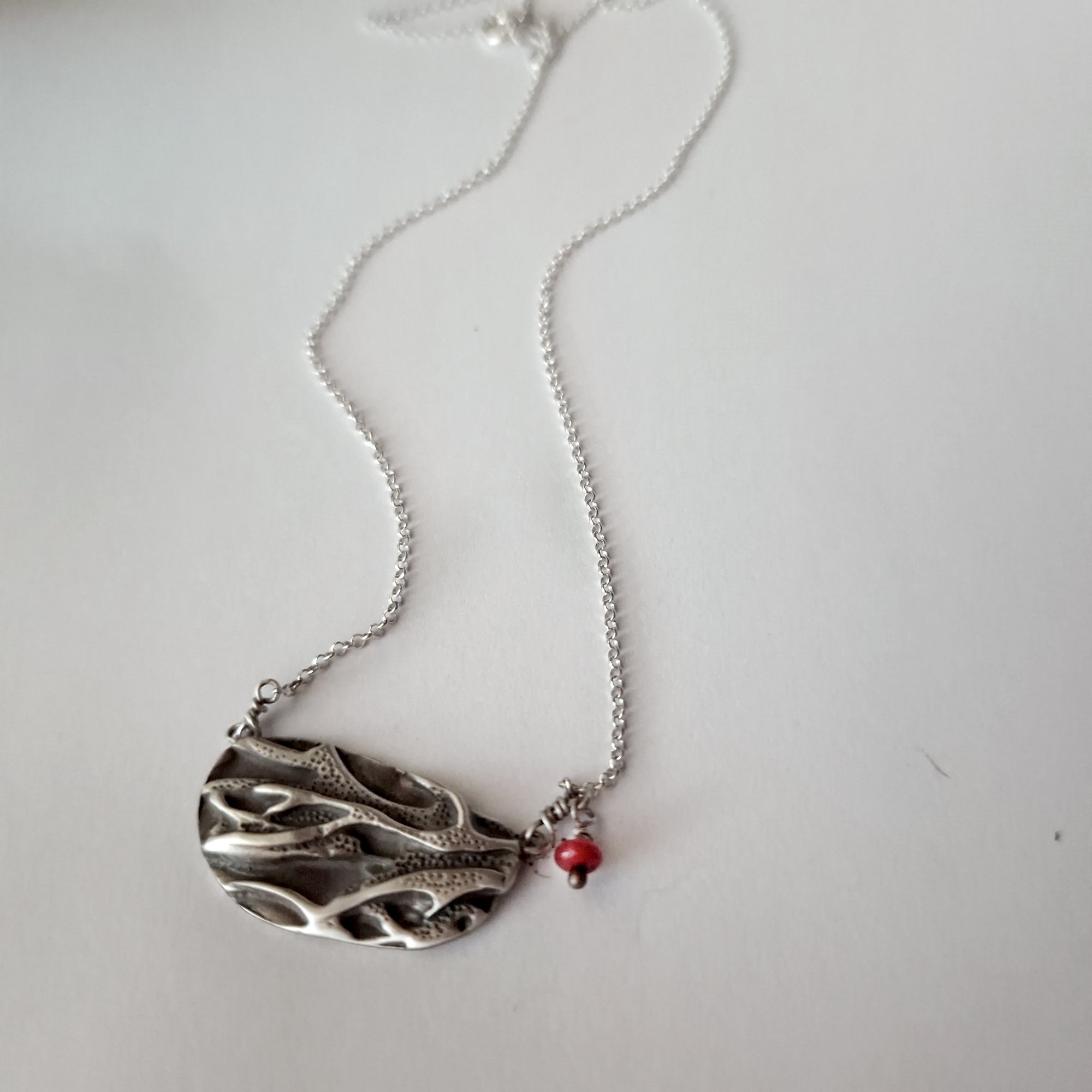 Silver necklace «coral» with dangling coral bead