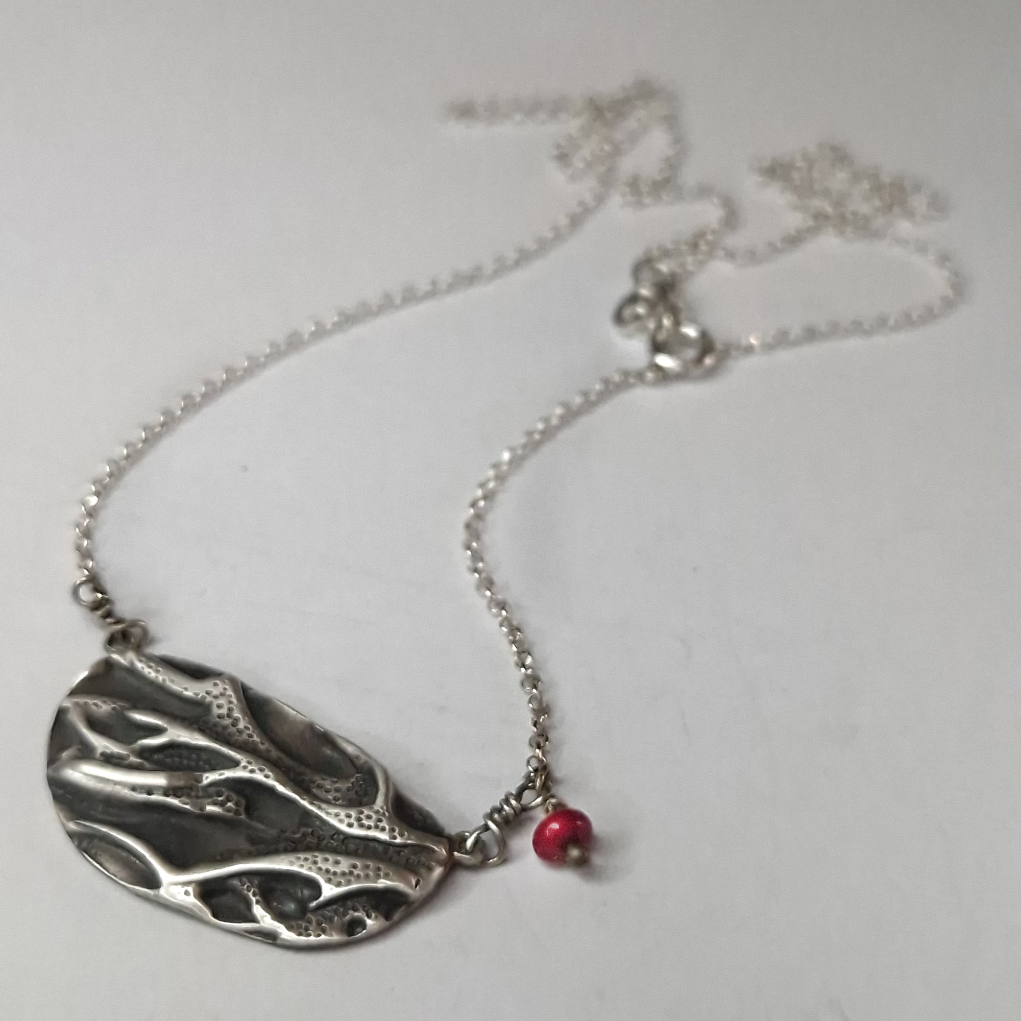 Silver necklace «coral» with dangling coral bead