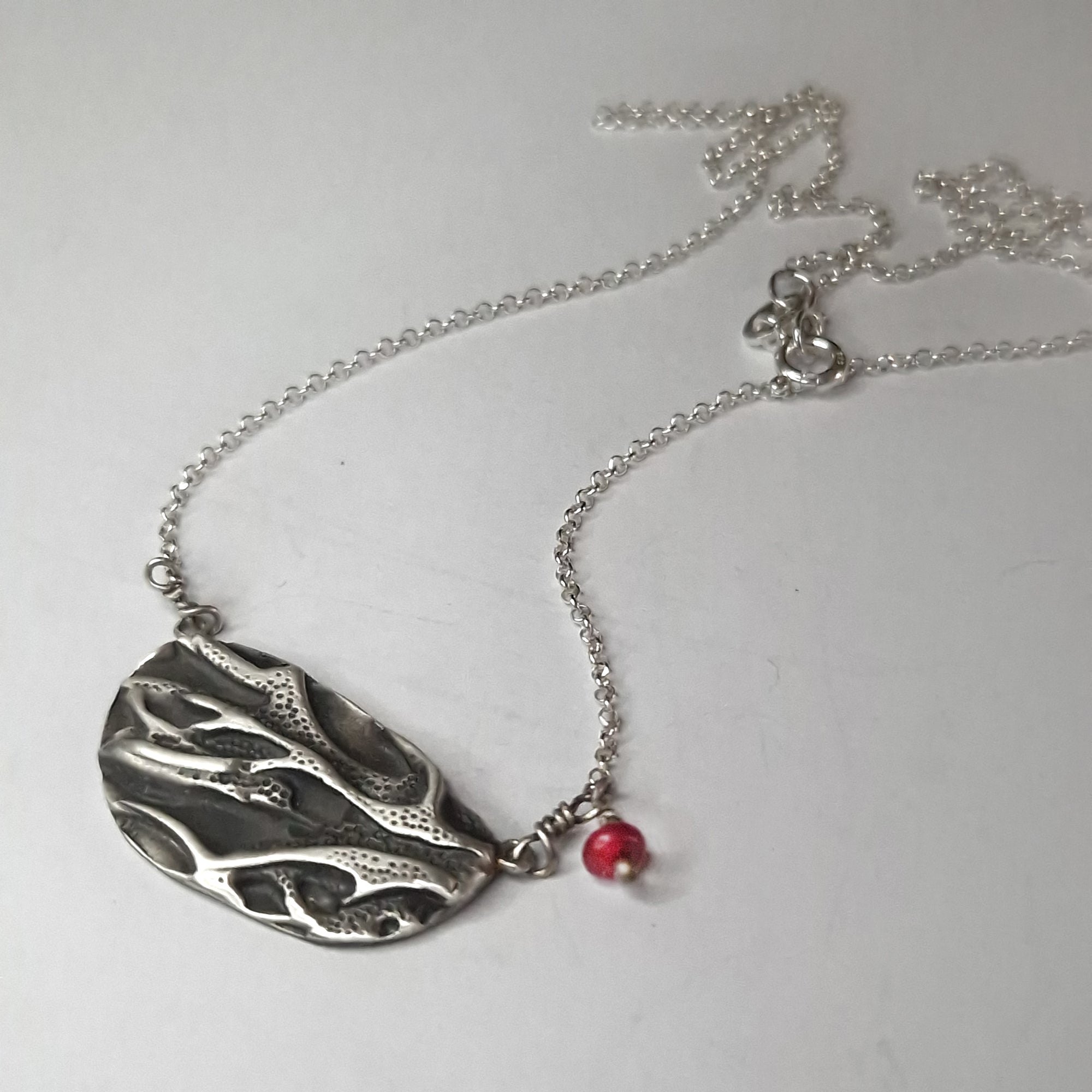 Silver necklace «coral» with dangling coral bead