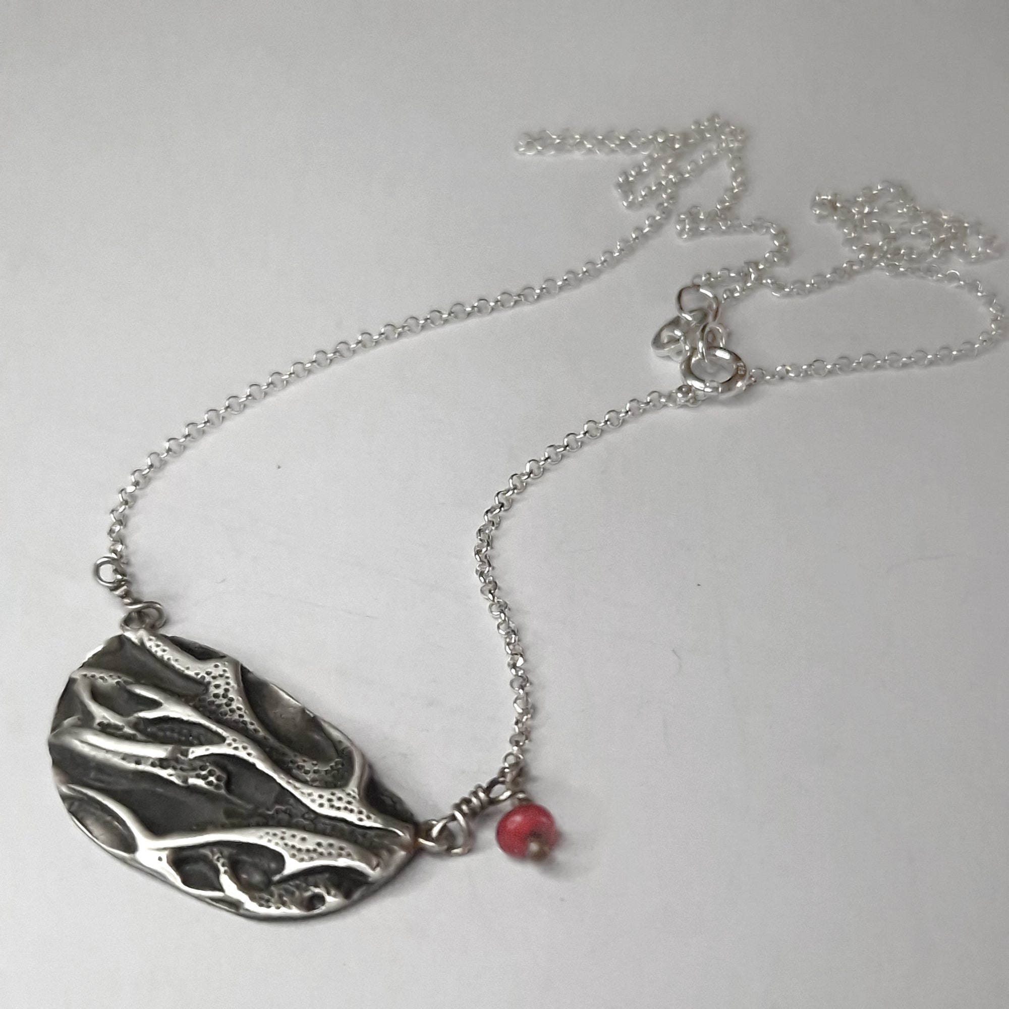 Silver necklace «coral» with dangling coral bead