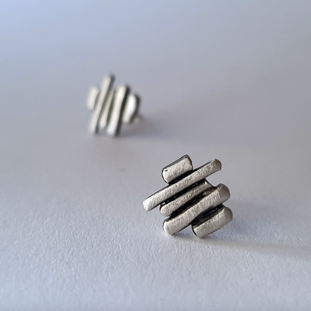 Silver stud earrings for men and woman.