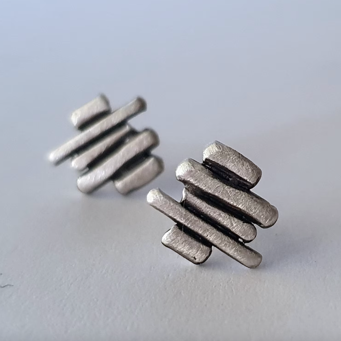 Silver stud earrings for men and woman.